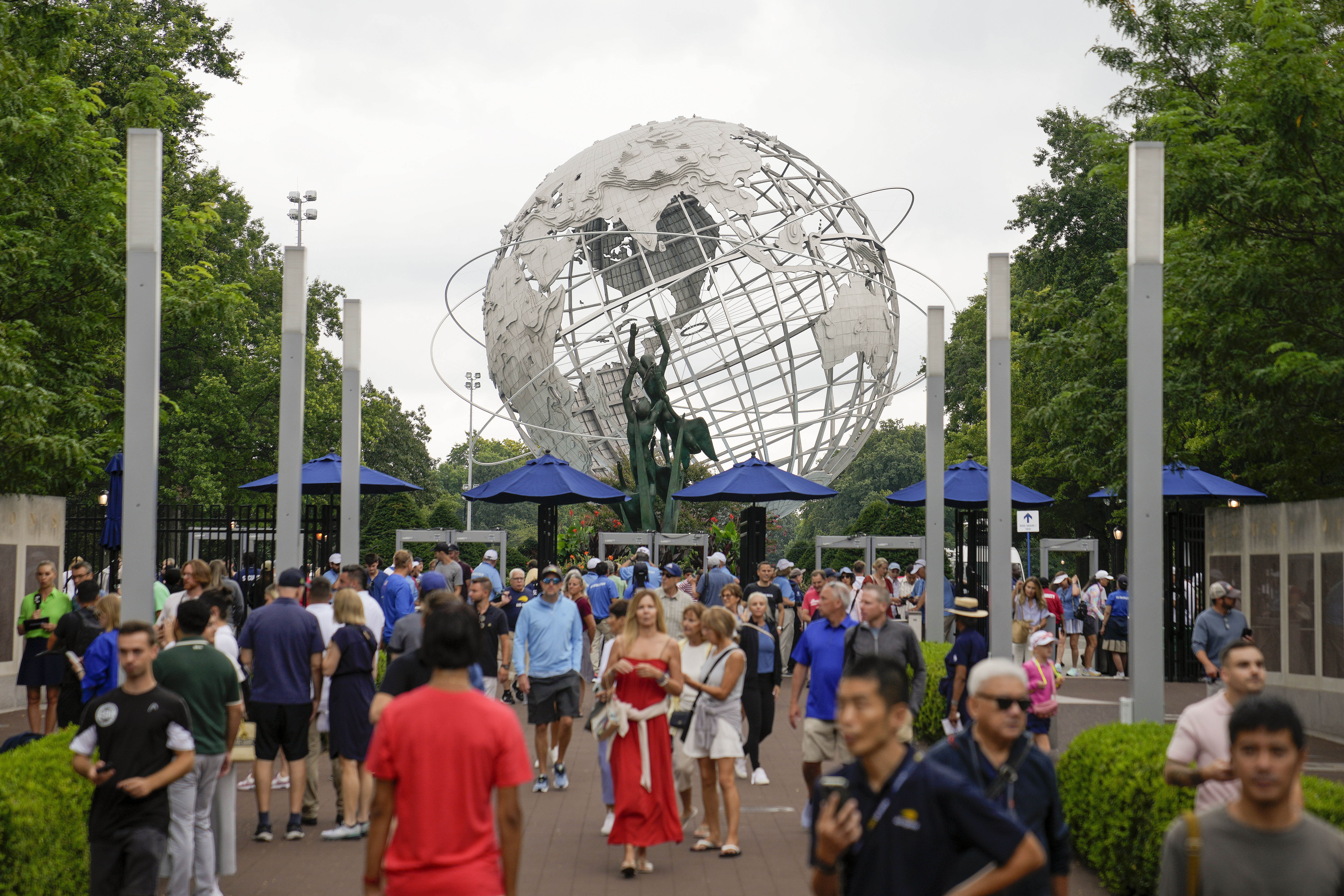 Tennis fans arrive at the Billie Jean King National Tennis Center for the first round of the U.S. Open tennis championships, Monday, Aug. 28, 2023, in New York. 