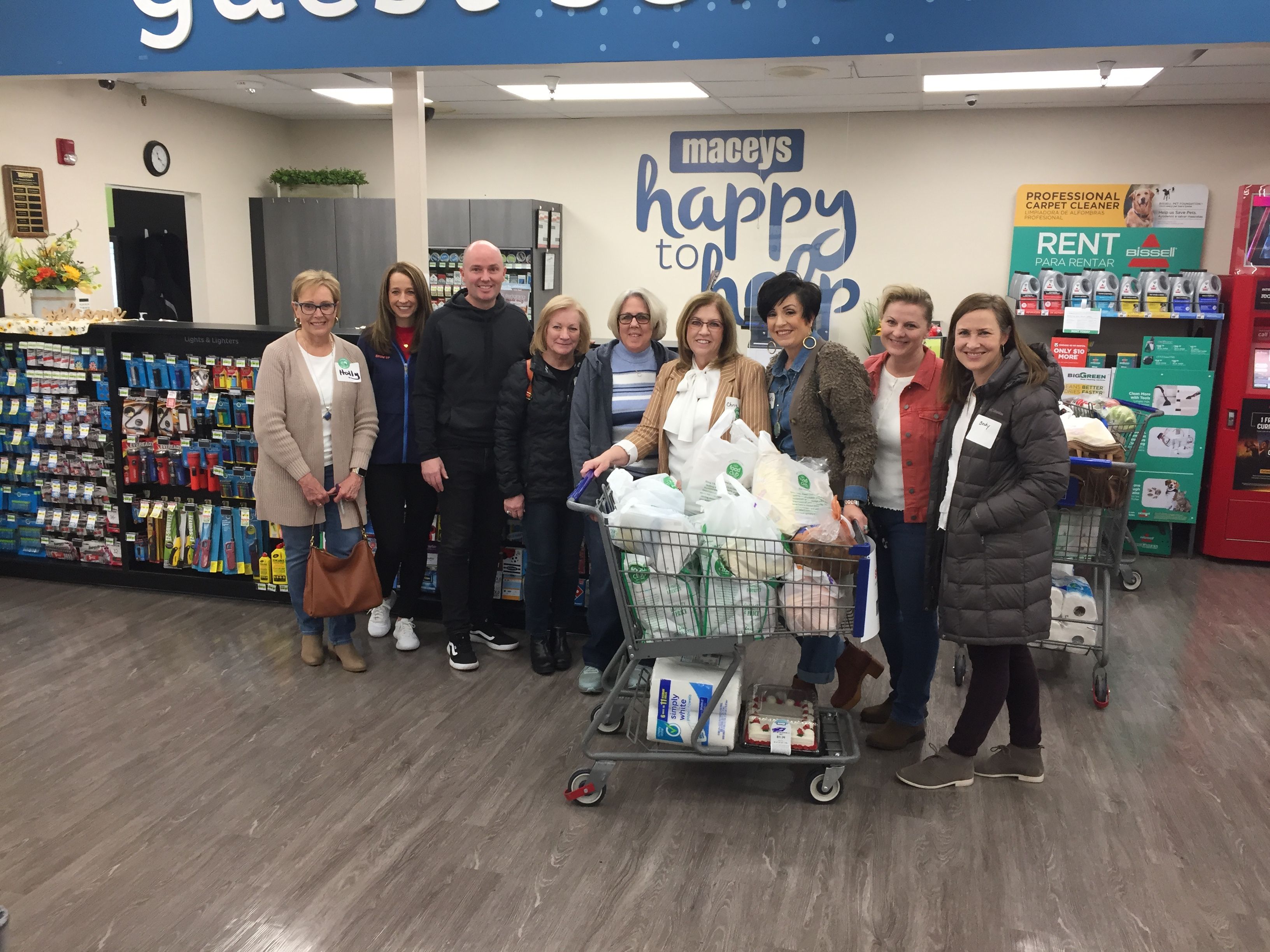Utah Gov. Spencer Cox, first lady Abby Cox and spouses of state legislators volunteer to help new Afghan arrivals fill their shopping carts on Feb. 18, 2022.