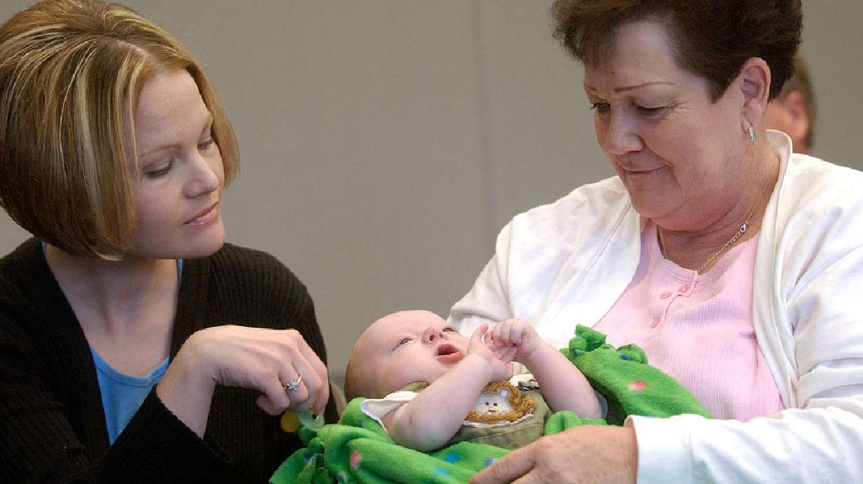 Left to right, Shelly Davies, looks at her 3-month-old son Maddyx, held by her mother Judy Steele, grandmother of Maddyx on April 20, 2006. The Utah birth rate has been on the decline quite steadily since 2008.