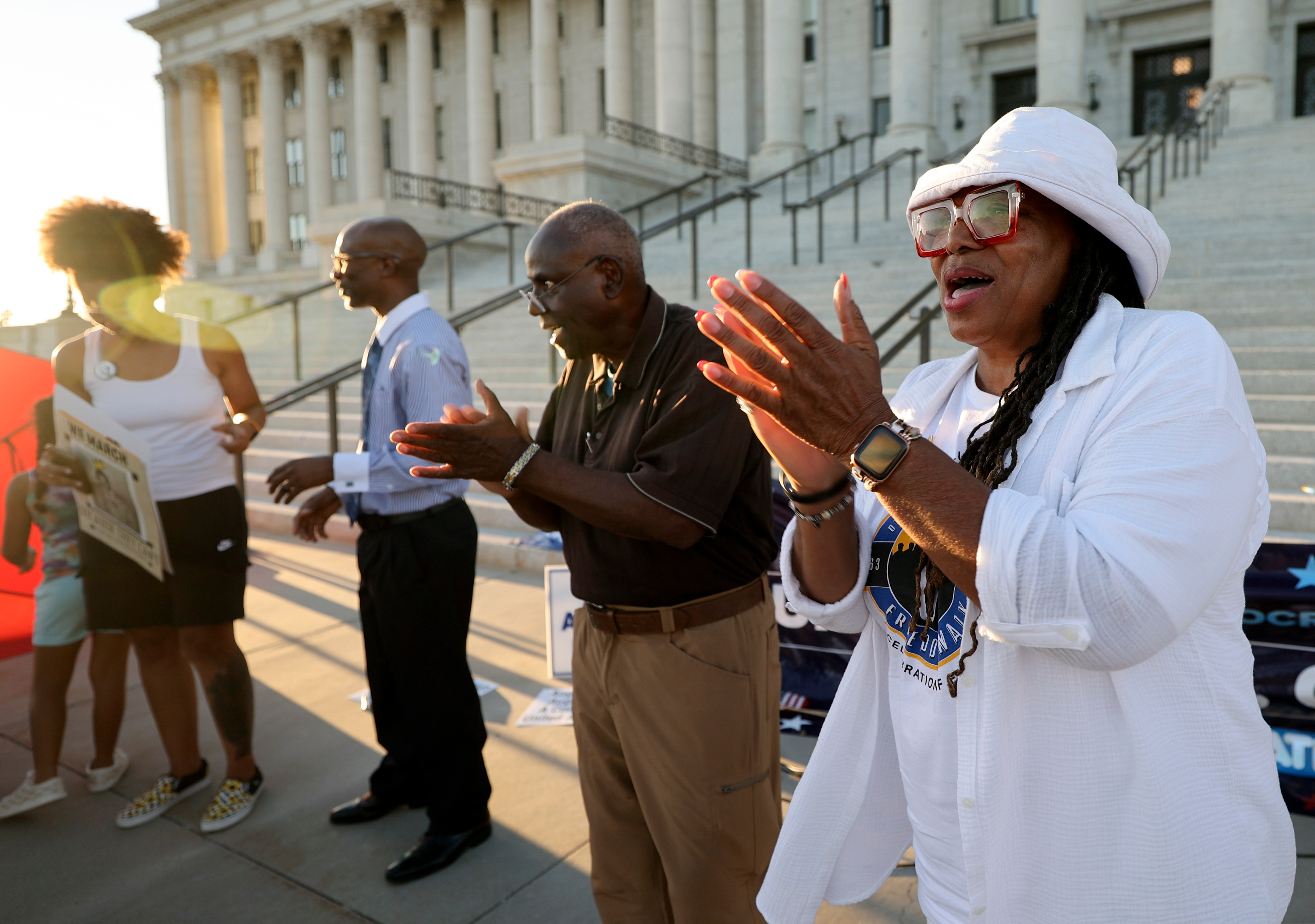 Betty Sawyer, Project Success Coalition executive director and Ogden NAACP president, and Dr. Forrest Crawford sing during a vigil to honor Americans who died because they were Black, on the 60th anniversary of the March on Washington for Jobs and Freedom, in front of the Capitol in Salt Lake City on Monday.