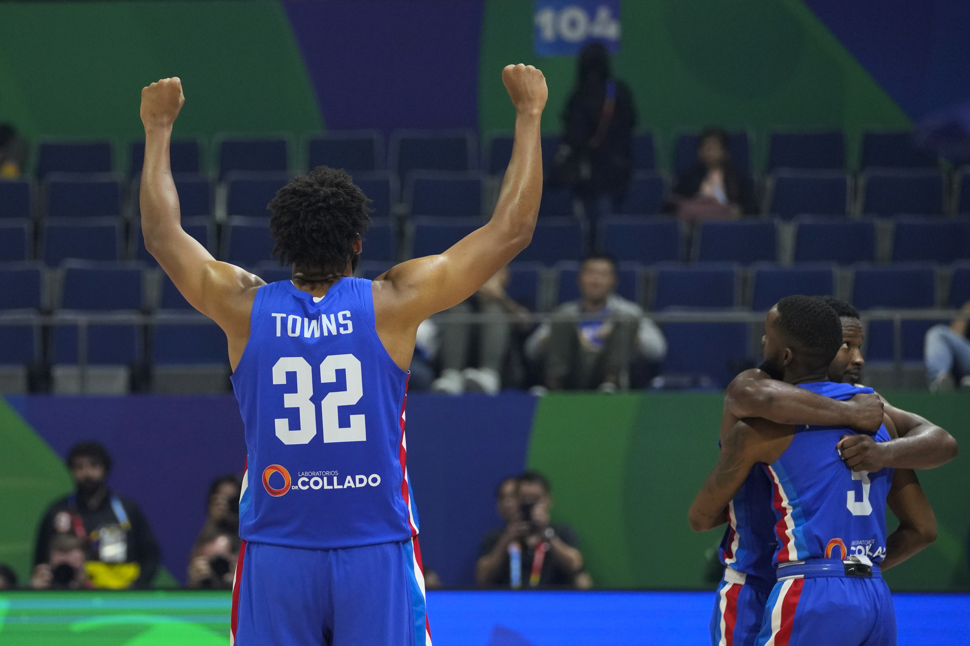 Dominican Republic forward Karl-Anthony Towns (32) and teammates celebrate after winning against Angola during their Basketball World Cup group A match at the Araneta Coliseum, Manila, Philippines on Tuesday, Aug. 29, 2023. 
