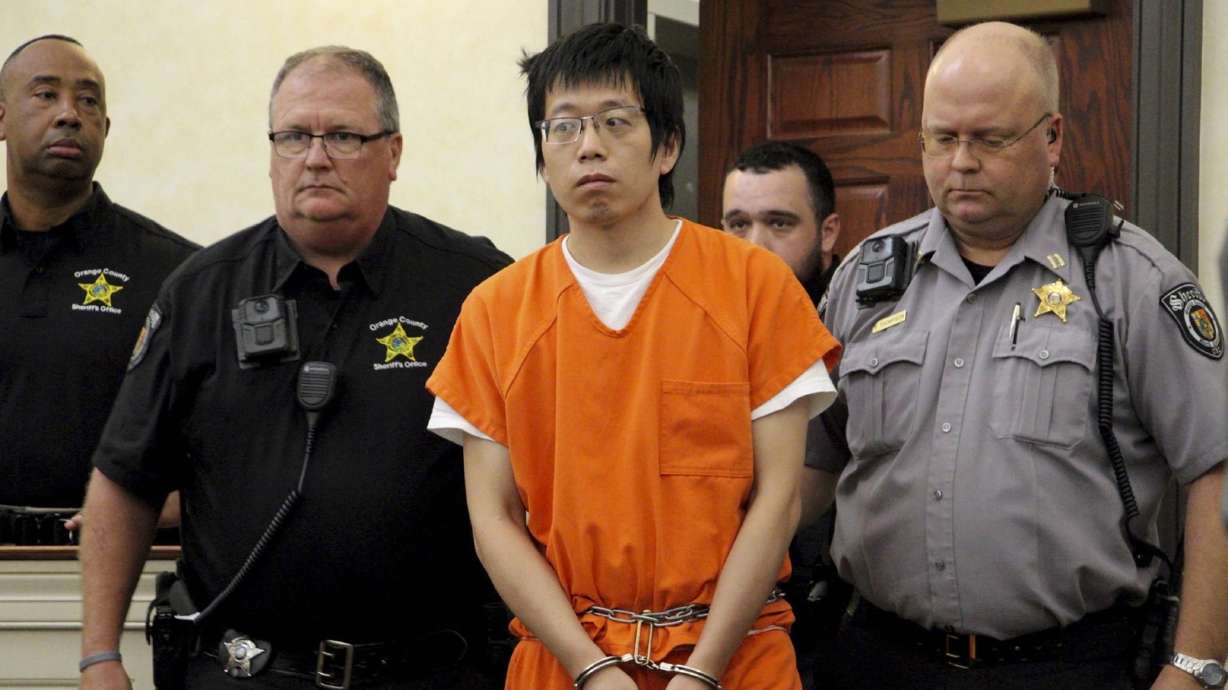 Tailei Qi, the graduate student suspected in the fatal shooting of a University of North Carolina at Chapel Hill faculty member, center, made his first appearance at the Orange County Courthouse in Hillsborough, N.C., Tuesday.