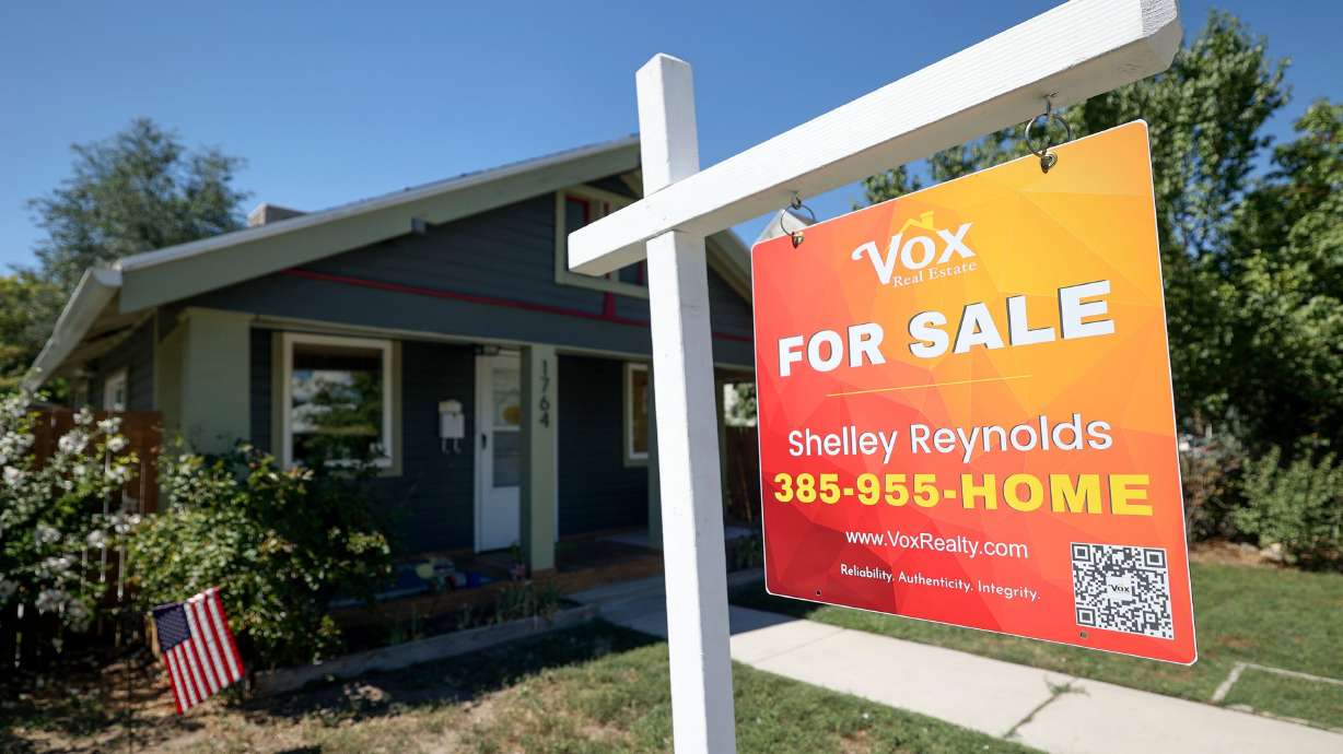 A for sale sign is pictured in Salt Lake City on Monday. U.S. home prices have climbed for five consecutive months and are just below their all-time high from a year ago.