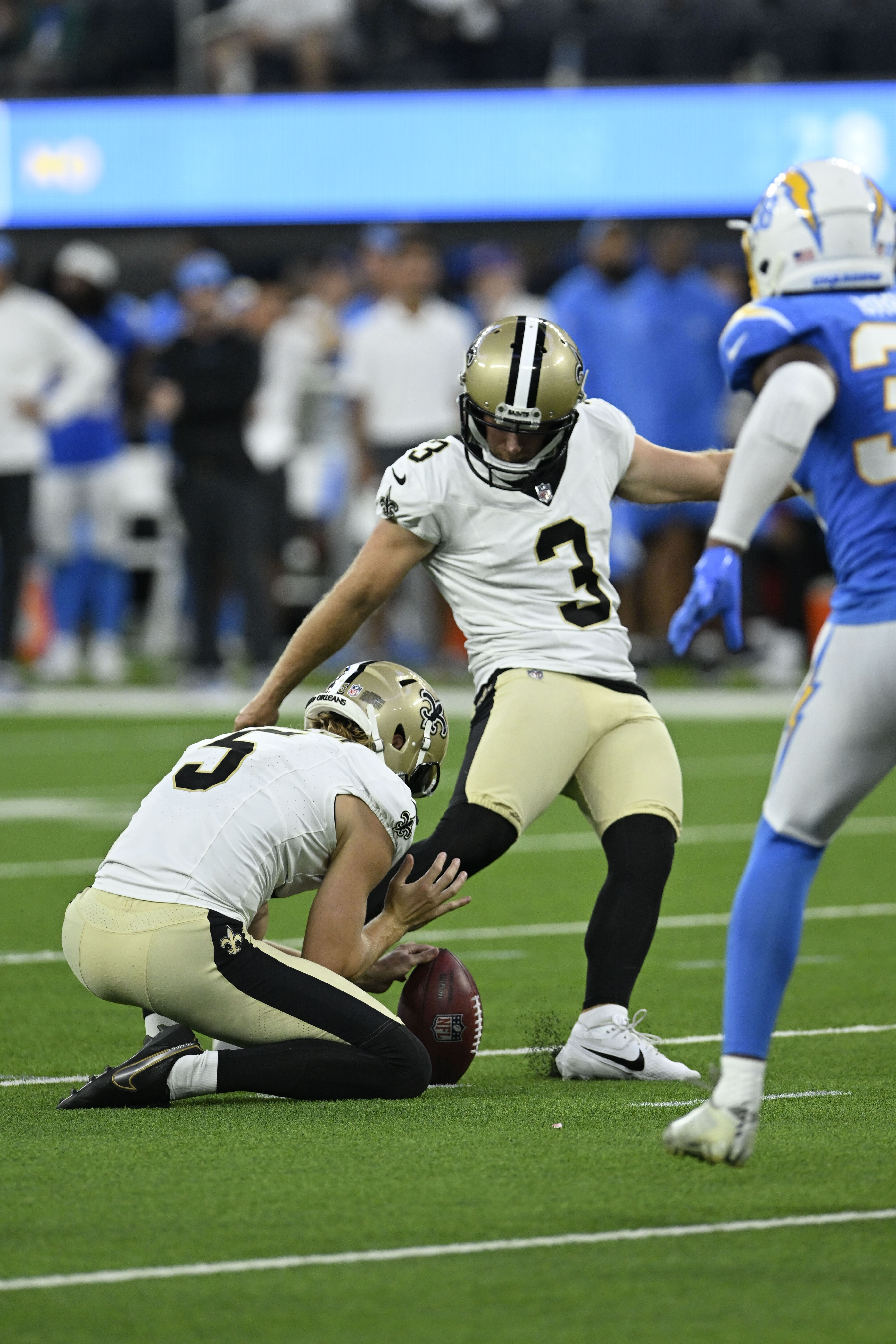 New Orleans Saints place kicker Wil Lutz (3) kicks a field goal in the second half of an NFL football game against the Los Angeles Chargers in Inglewood, Calif., Sunday, Aug. 20, 2023.