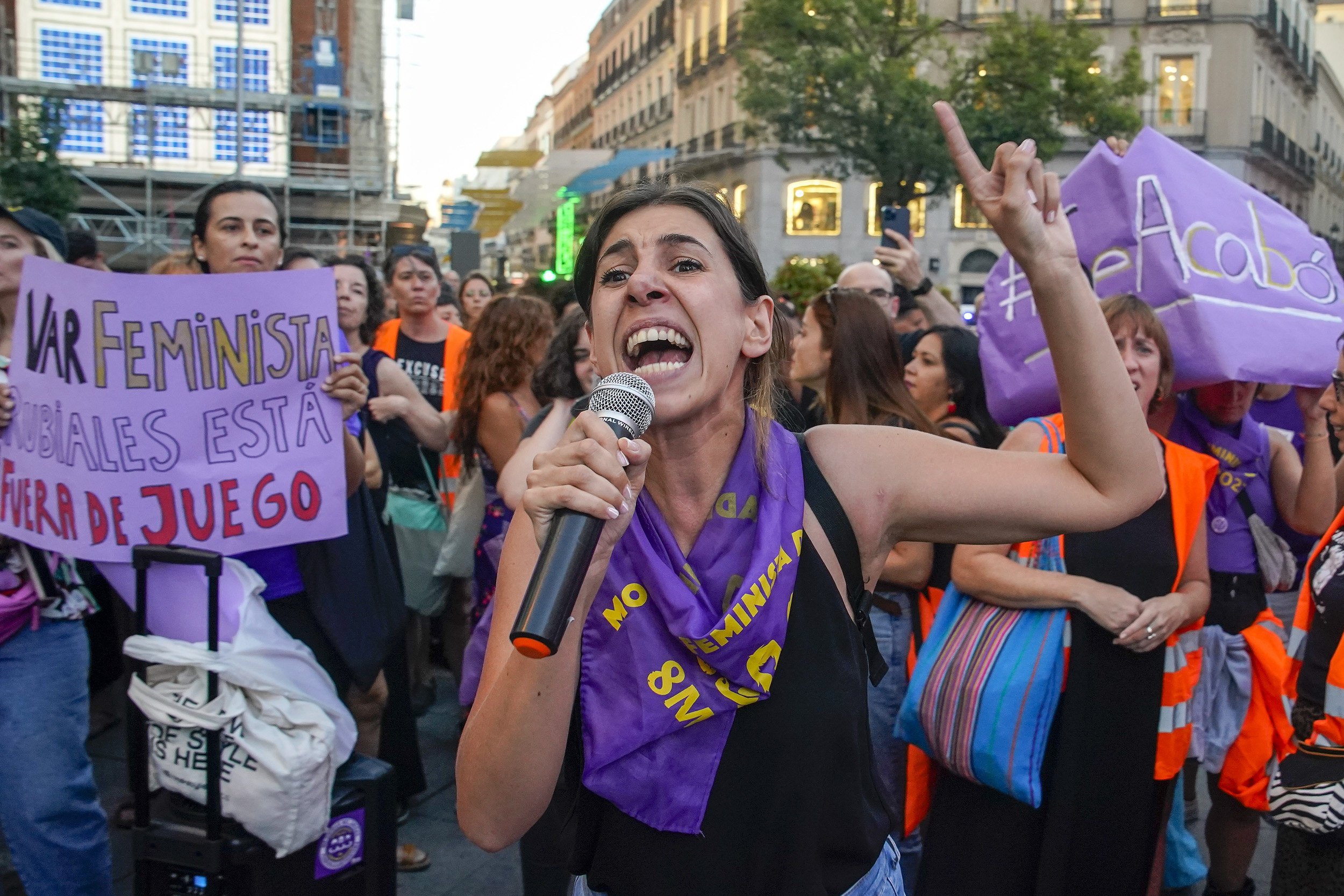 A demonstrator shouts slogans during a protest against the President of Spain's soccer federation Luis Rubiales and to support to support Spain's national women's soccer player Jenni Hermoso in Madrid on Monday, Aug. 28, 2023. Spain faces reckoning over sexism in soccer after federation head kisses player at Women's World Cup. Banner reads in Spanish "it's over" and "Rubiales is out of the game". 