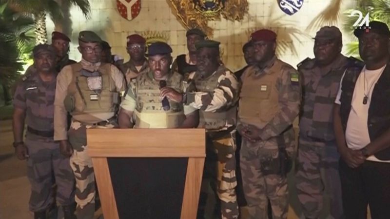 This video grab shoes the spokesperson for the mutinous soldiers speaking on state television as they announce that they had seized power in Libreville, Wednesday.