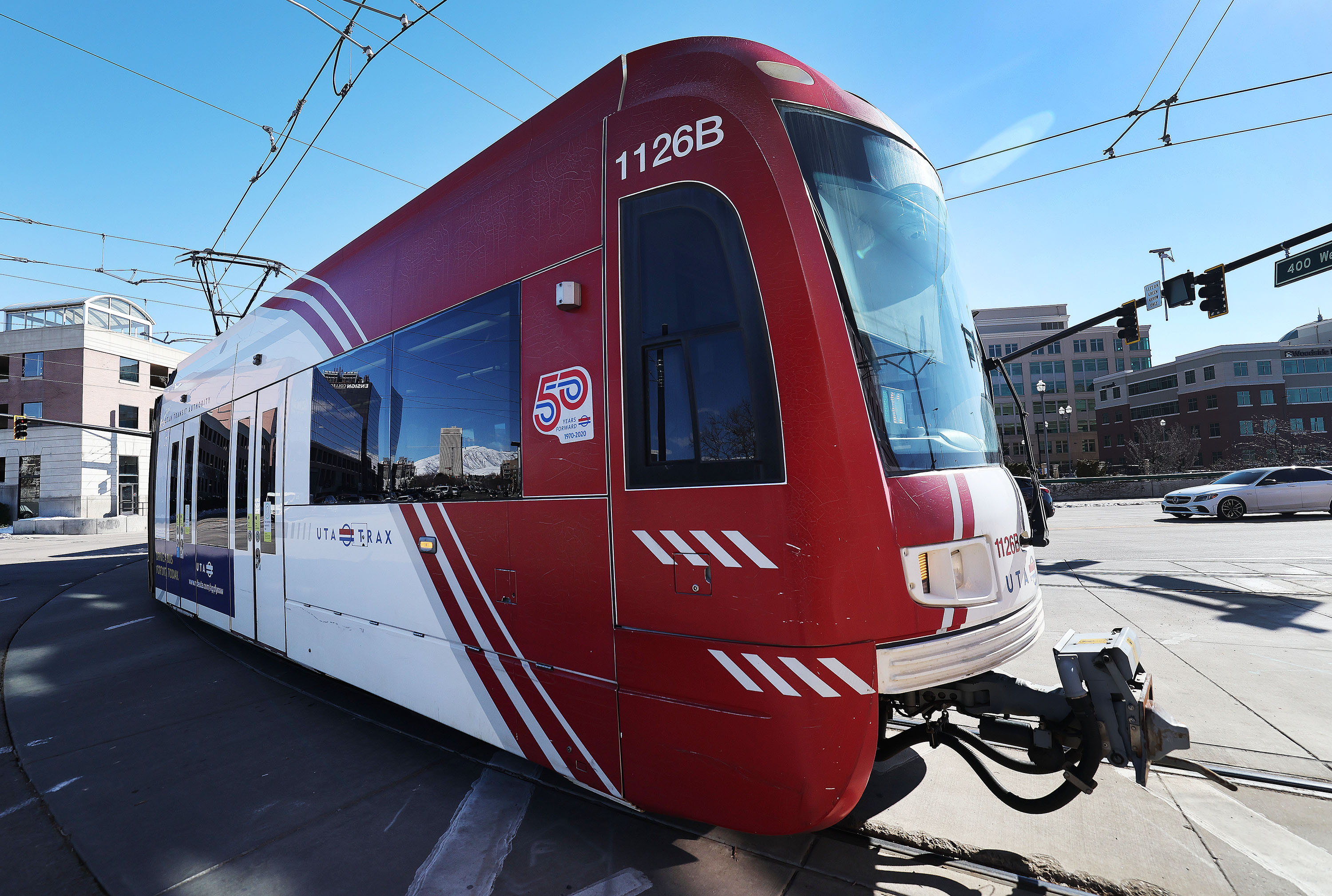 A woman is in critical condition from being hit by a Red Line TRAX train Wednesday morning.