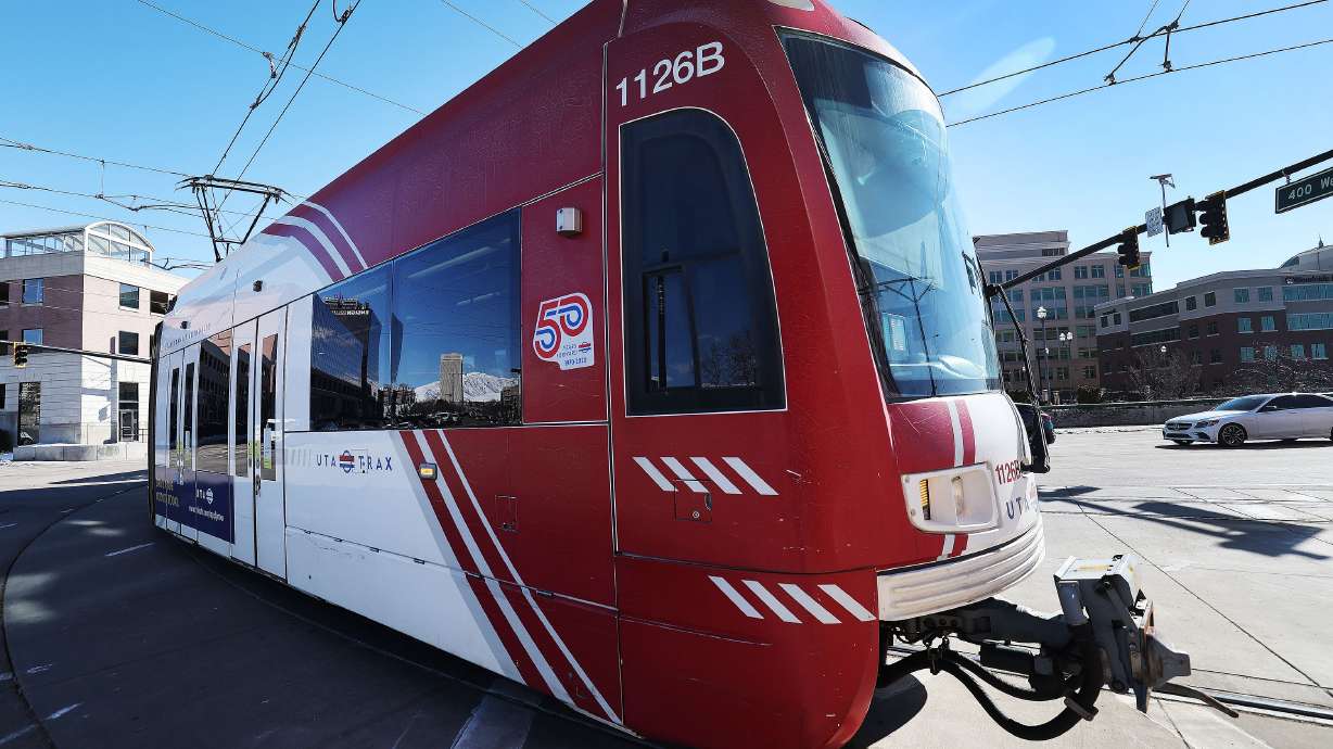 A woman is in critical condition from being hit by a Red Line TRAX train Wednesday morning.