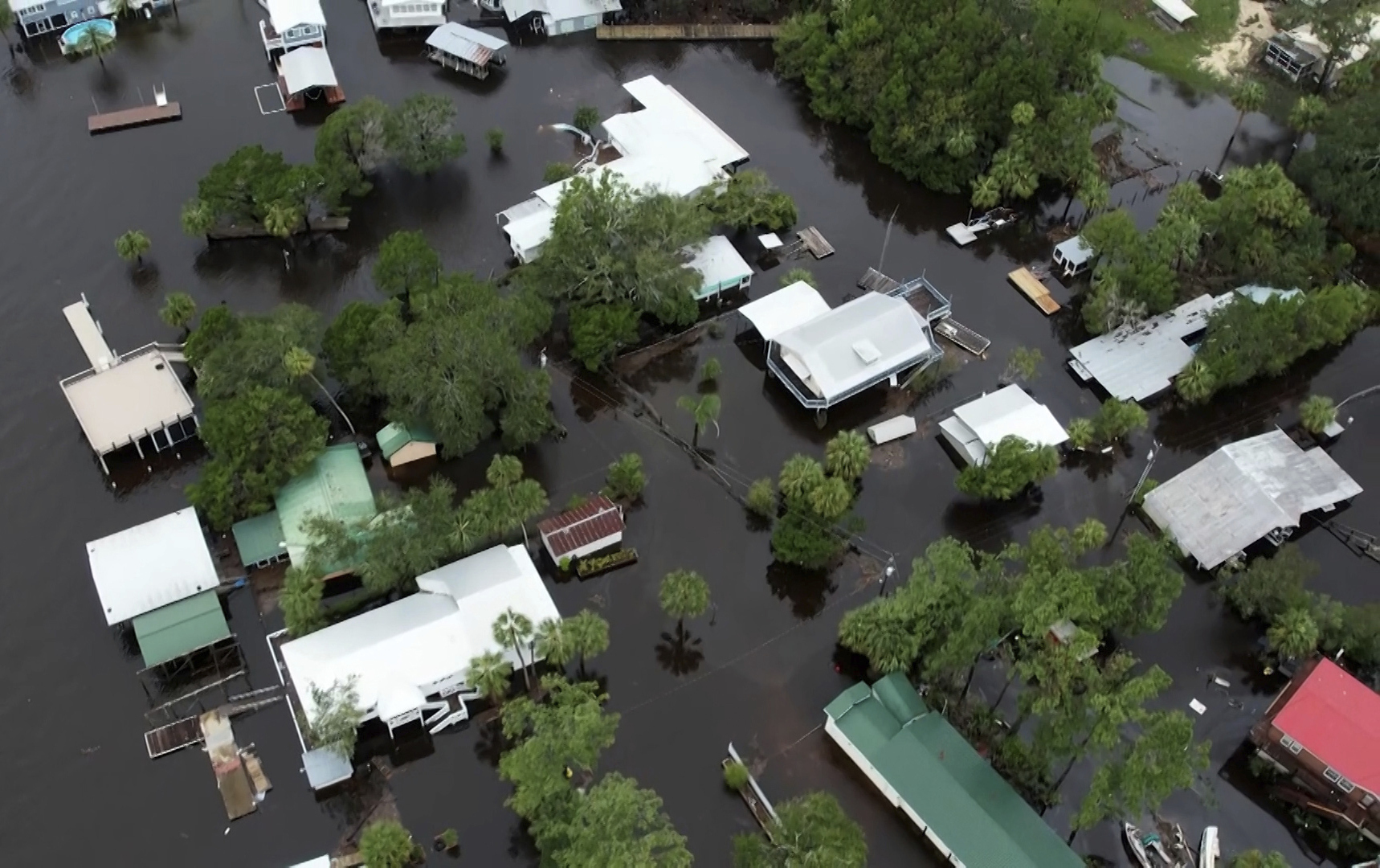 This aerial photo shows homes surrounded by floodwaters in Steinhatchee, Florida, Wednesday left behind by Hurricane Idalia.