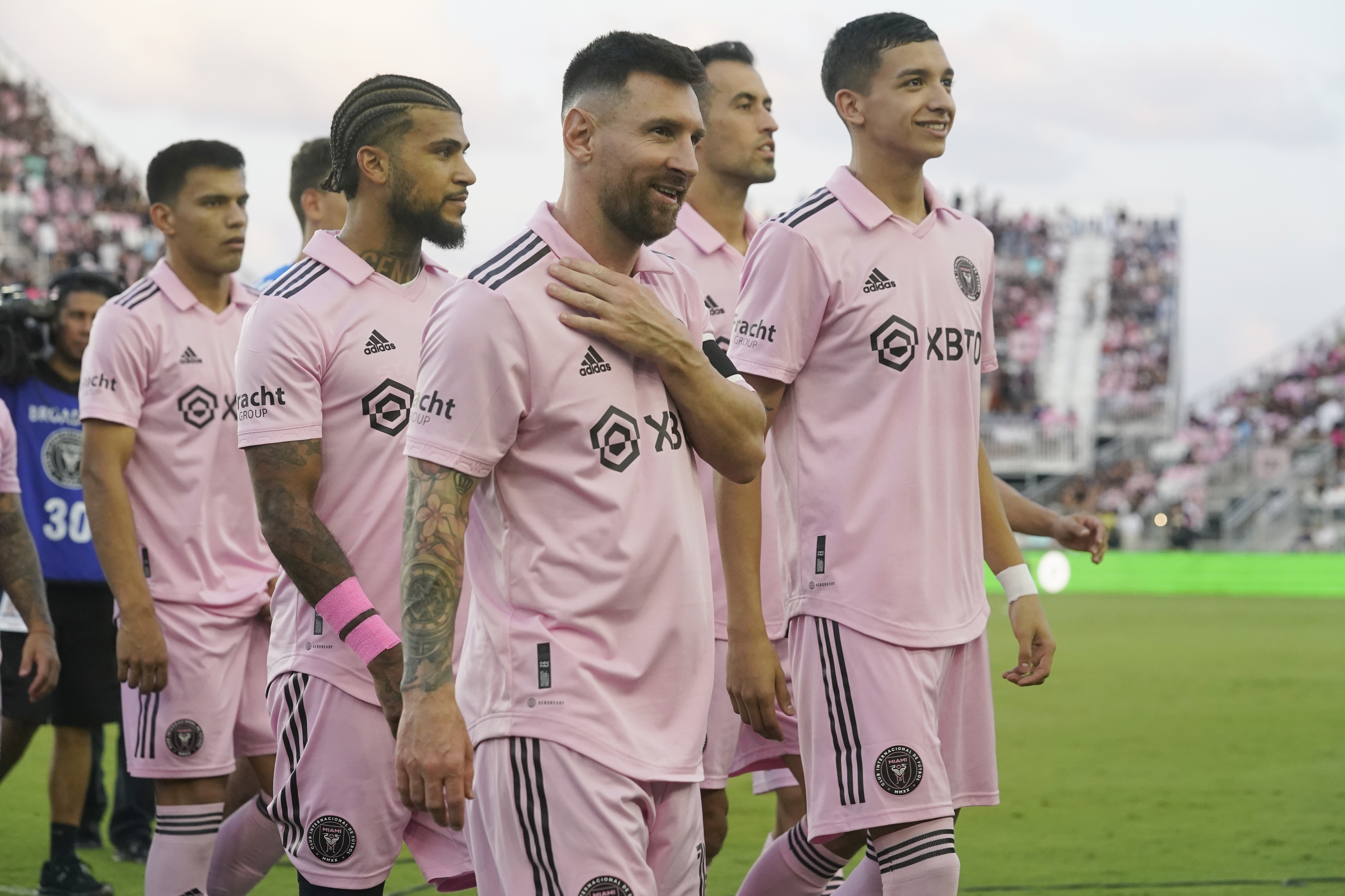 Inter Miami forward Lionel Messi and his teammates acknowledge the cheers from the crowd after the presentation of the League Championship trophy before the first half of an MLS soccer match against Nashville SC, Wednesday, Aug. 30, 2023, in Fort Lauderdale, Fla.