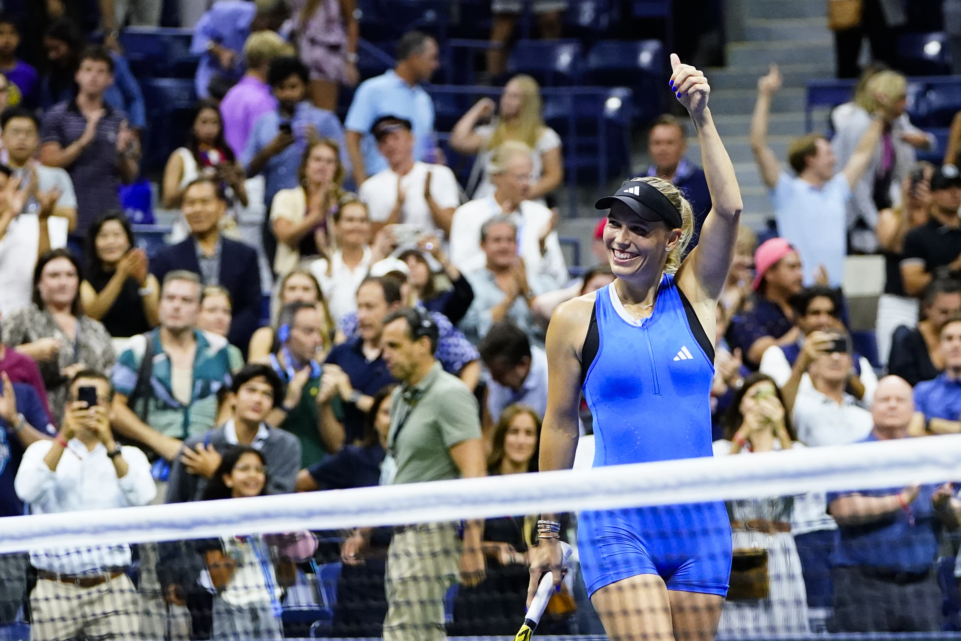 Caroline Wozniacki, of Denmark, celebrates winning her match against Petra Kvitova, of the Czech Republic, during the second round of the U.S. Open tennis championships, Wednesday, Aug. 30, 2023, in New York. 