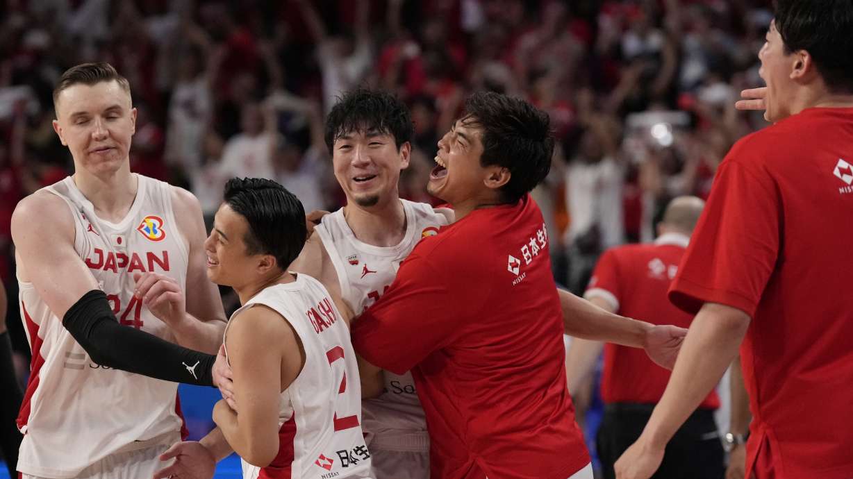 Japan's team members celebrate after defeating Venezuela in their Basketball World Cup classification match in Okinawa, southern Japan, Thursday, Aug. 31, 2023.