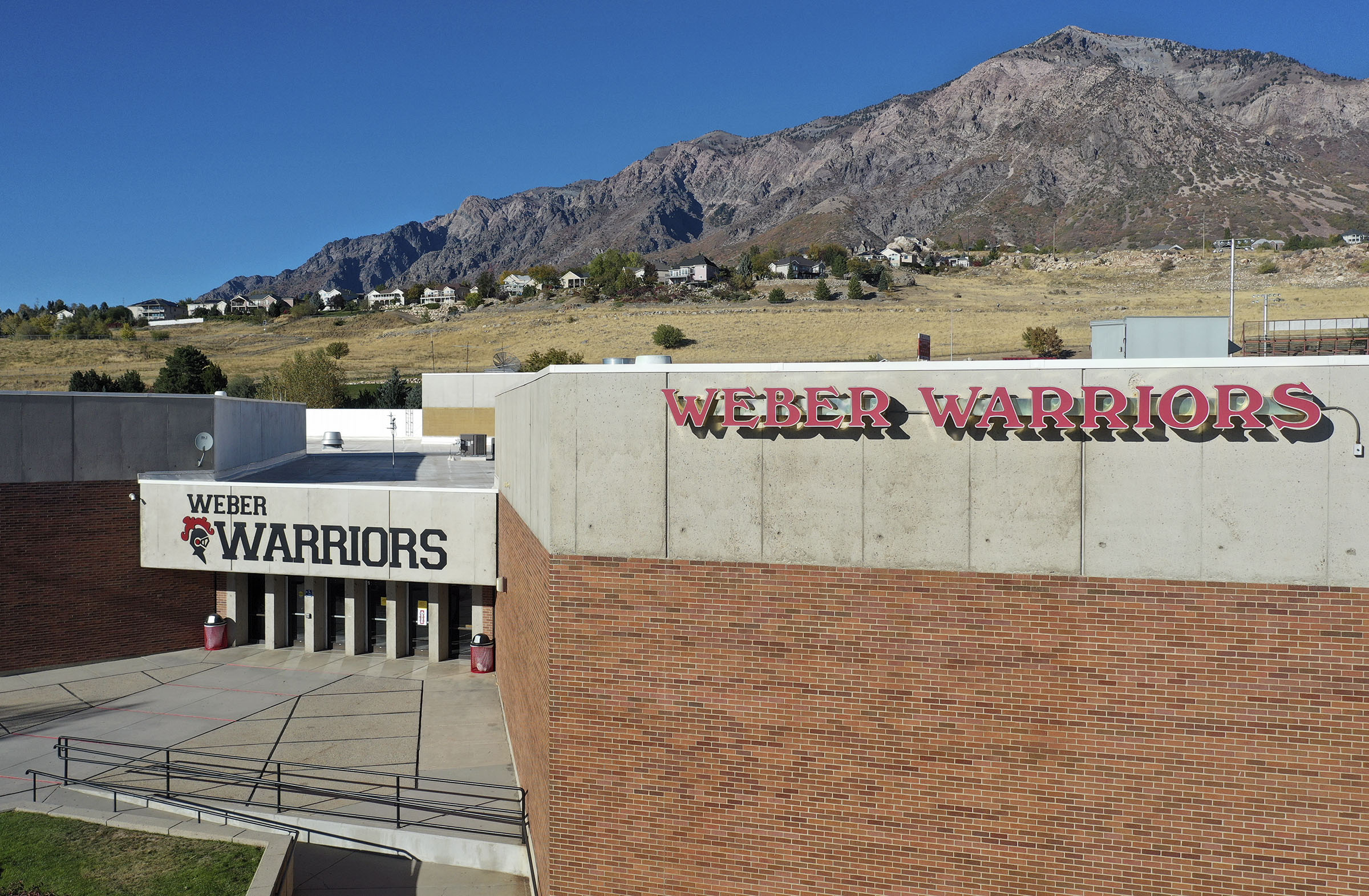 Complaints that led to Weber High School's principal being placed on administrative leave are related to how she investigated allegations of inappropriate football recruiting, the district said Thursday.