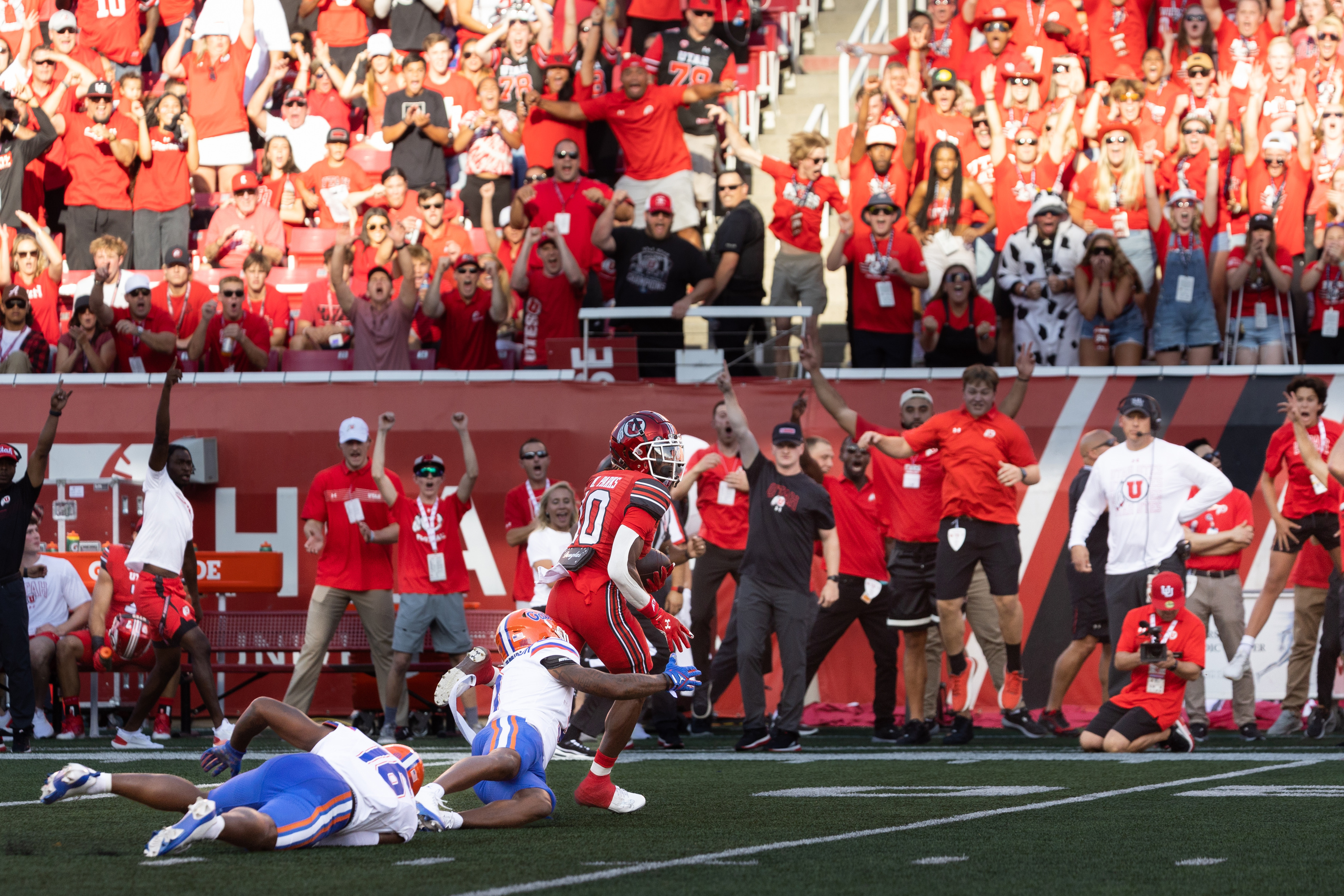 Utah Utes wide receiver Money Parks (10) breaks away and scores a touchdown on a catch from Utah Utes quarterback Bryson Barnes (16) during the first quarter of their season opener against Florida at Rice-Eccles Stadium in Salt Lake City on Thursday, Aug. 31, 2023.