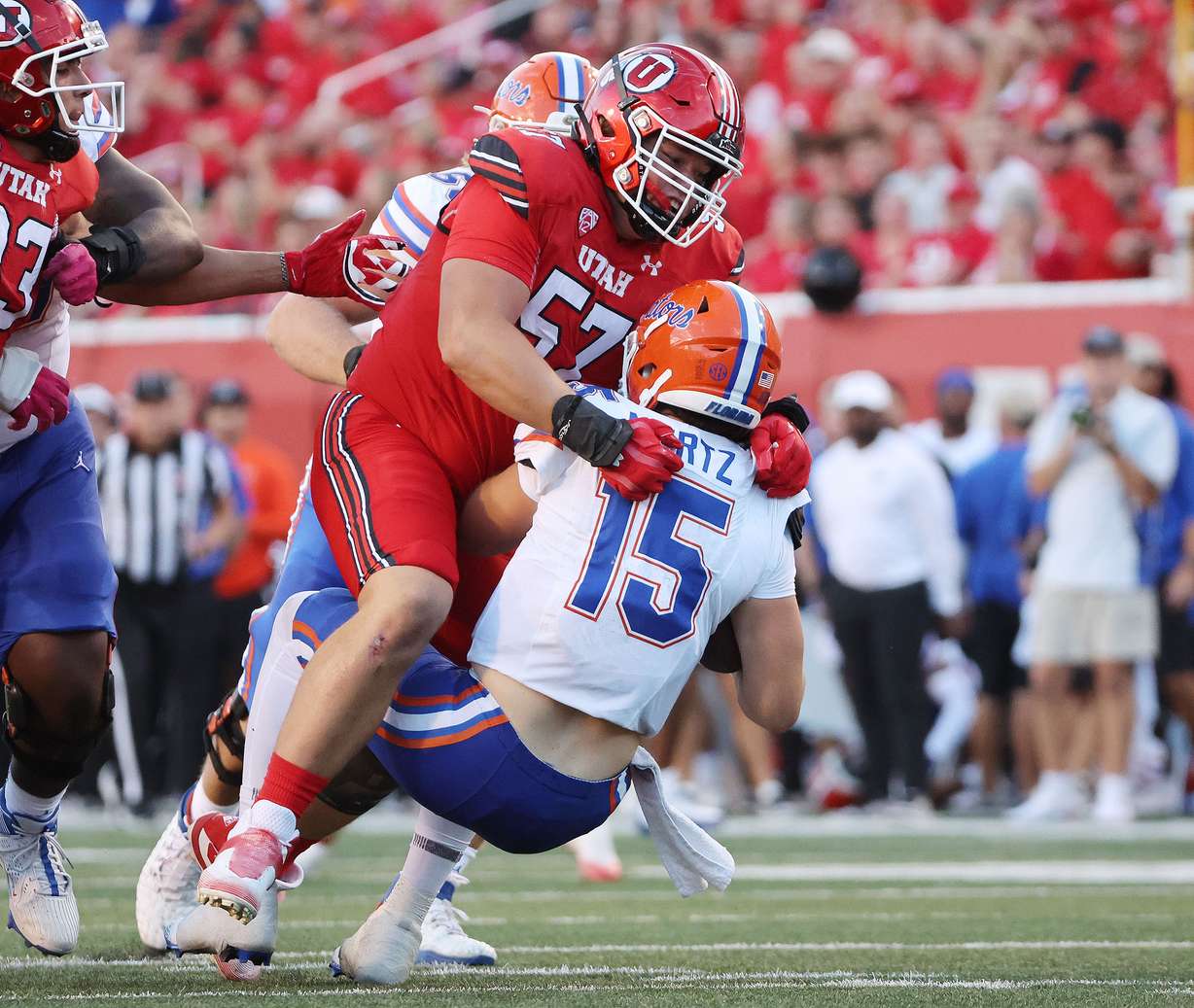 Utah Utes defensive tackle Keanu Tanuvasa (57) sacks Florida Gators quarterback Graham Mertz (15) in Salt Lake City on Thursday, Aug. 31, 2023 during the season opener.