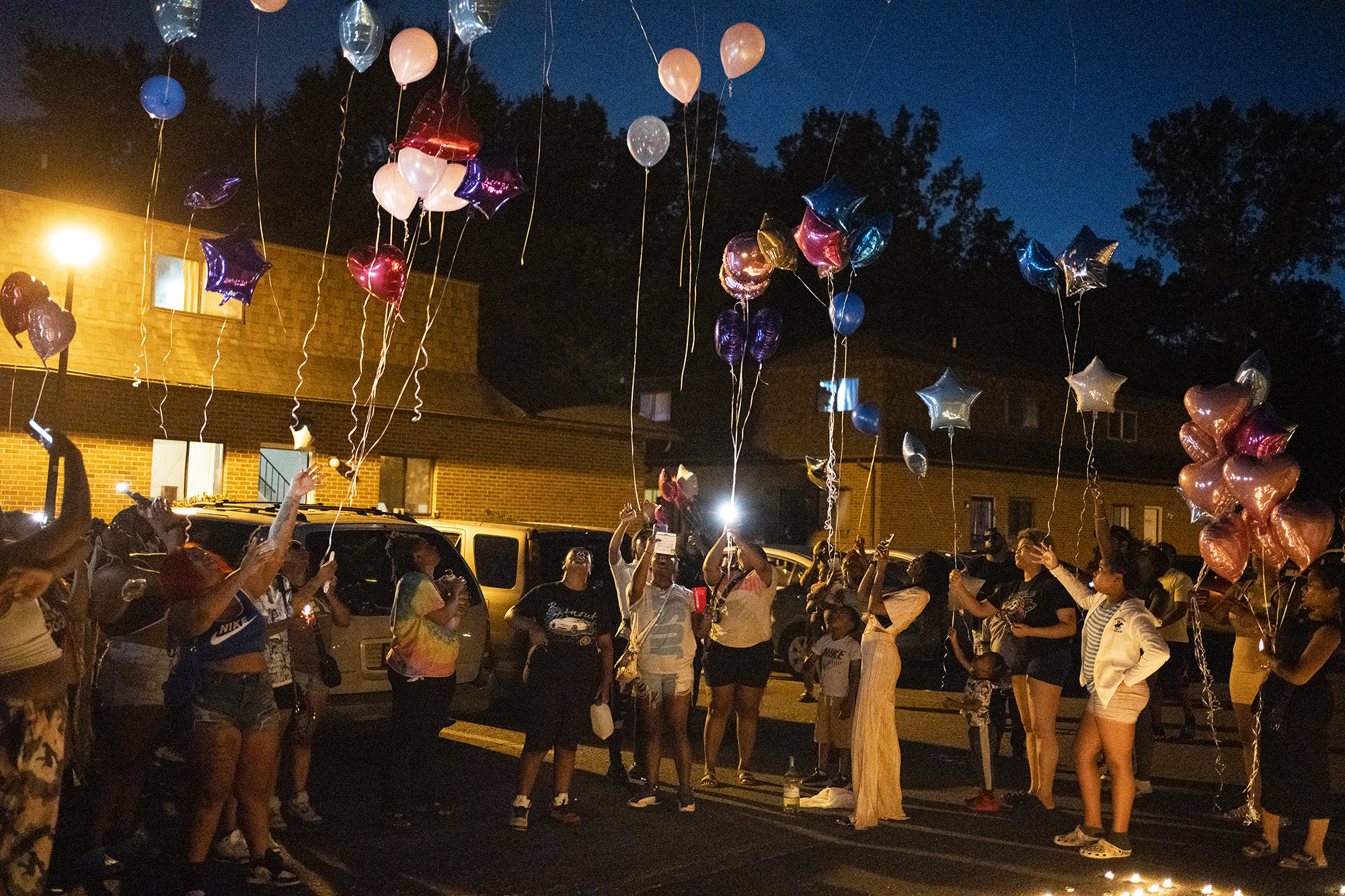 Family and friends release balloons at a private vigil on Aug. 25, 2023, in Columbus, Ohio, held for 21-year-old Ta'Kiya Young, who was shot and killed a day earlier by Blendon Township police outside an Ohio supermarket. Young was pregnant and due to give birth in November, according to her family.