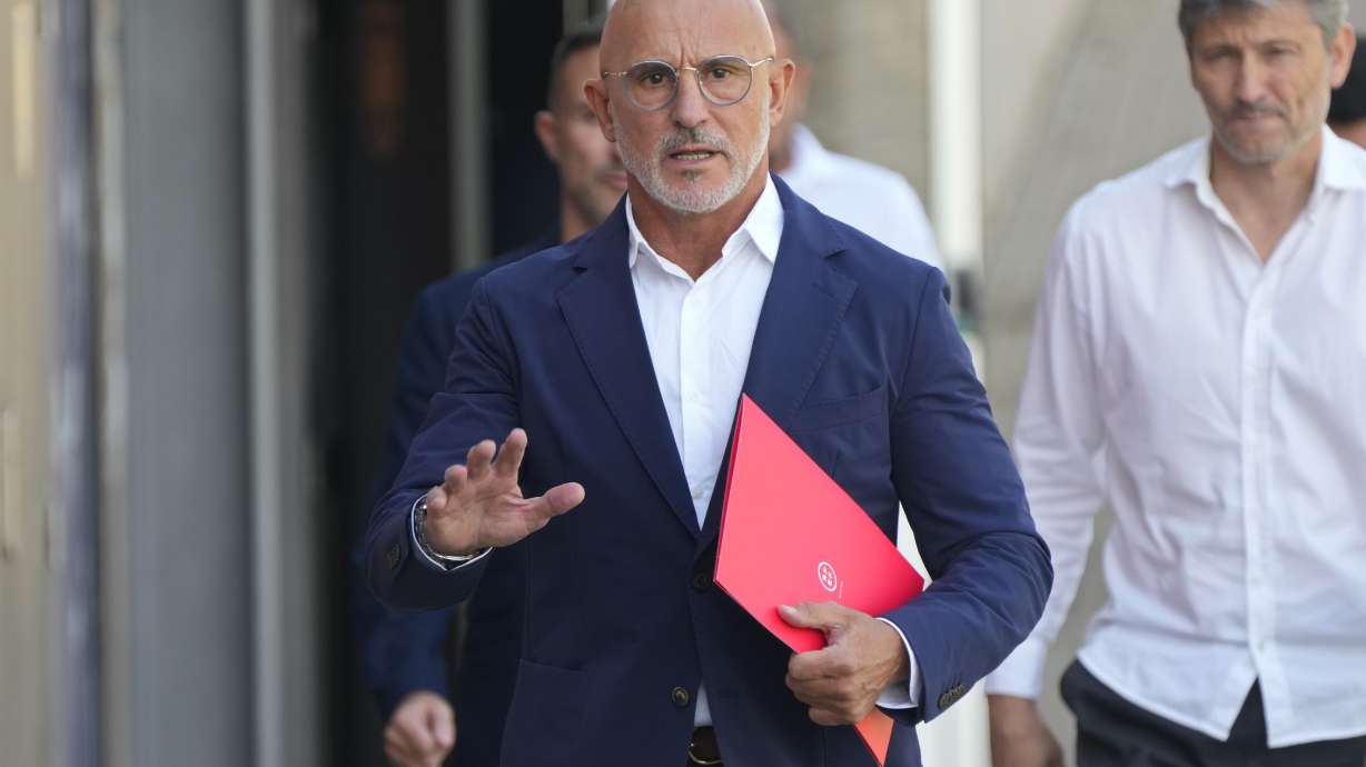 Spain's national soccer coach Luis de la Fuente arrives to give a press conference where he will announce the squad for the upcoming international Euro 2024 qualifying matches, in Las Rozas, Spain, Friday, Sept. 1, 2023.