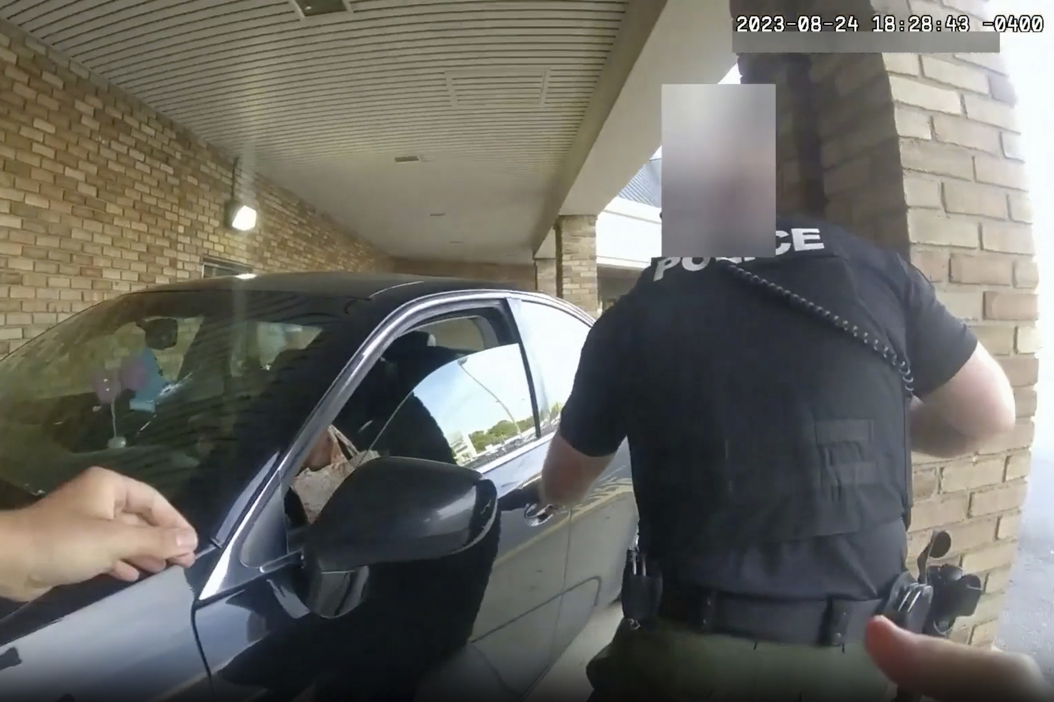 This still image from bodycam video released by the Blendon Township Police on Friday shows a bullet hole in the windshield of a car with Ta’Kiya Young inside after she was shot by a police officer outside a grocery store in Blendon Township, Ohio, a suburb of Columbus, on Aug. 24. The pregnant Black mother was pronounced dead shortly after the shooting. Her unborn daughter did not survive.