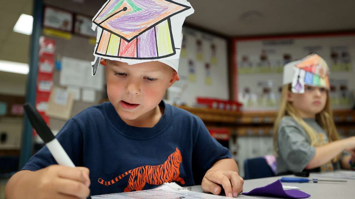 Kindergartner Maverick Hill practices writing his name during Kindergarten College-Ready Day at Ridgecrest Elementary School in Cottonwood Heights on Friday.