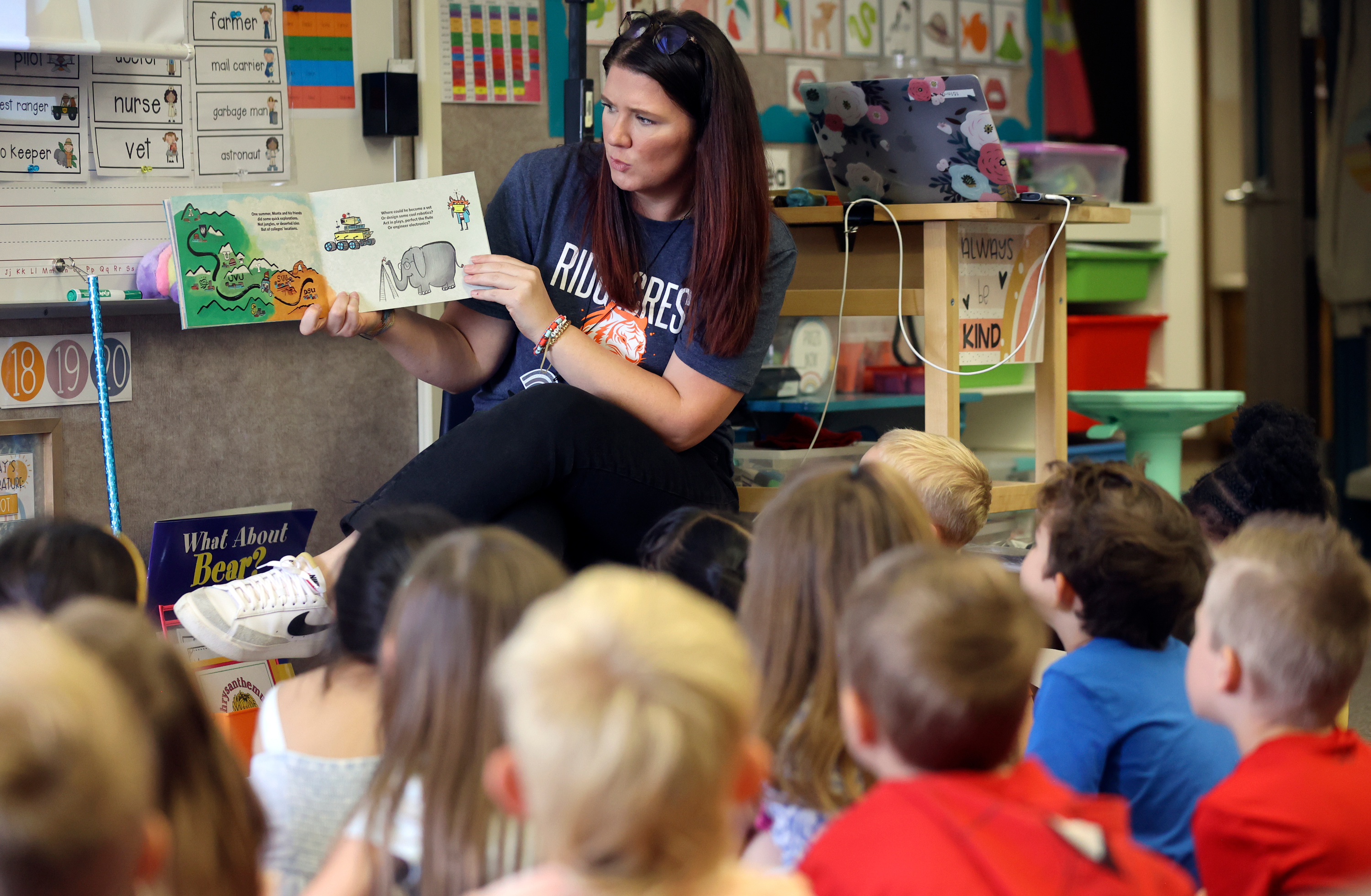 Kindergarten teacher Courtney Terry reads “Monte Goes to College” to her class during Kindergarten College-Ready Day at Ridgecrest Elementary School in Cottonwood Heights on Friday.
