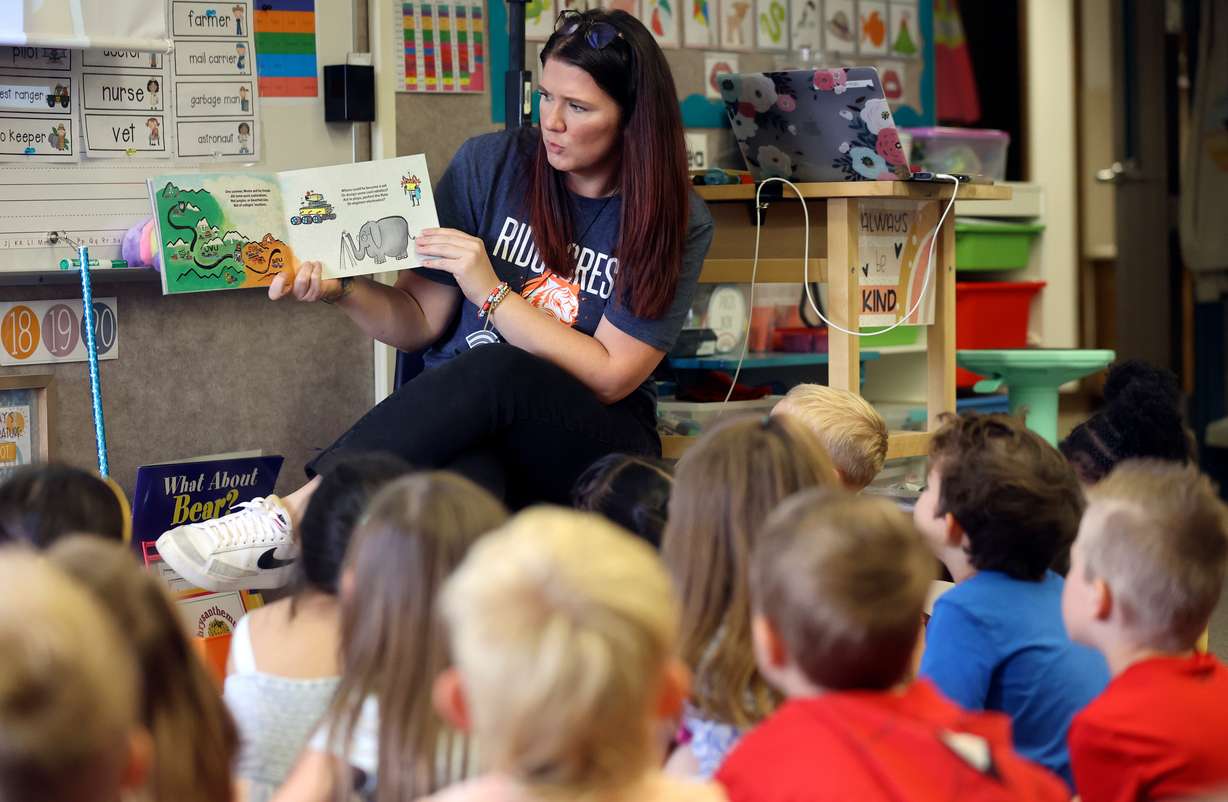 Kindergarten teacher Courtney Terry reads “Monte Goes to College” to her class during Kindergarten College-Ready Day at Ridgecrest Elementary School in Cottonwood Heights on Friday.
