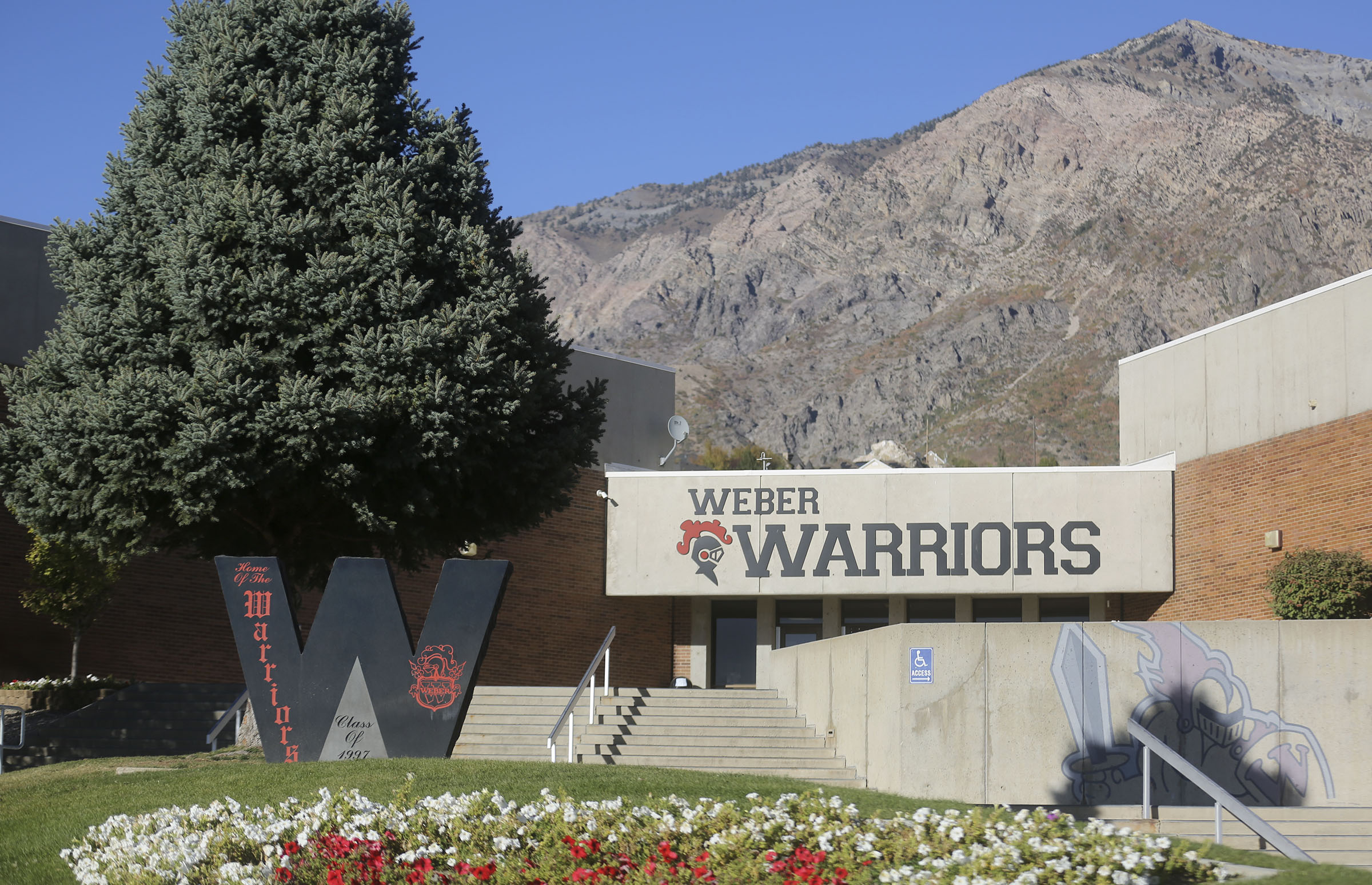 Amid an ongoing investigation into the Weber High School principal and the school's football program, the district on Thursday fired the team's offensive coordinator.