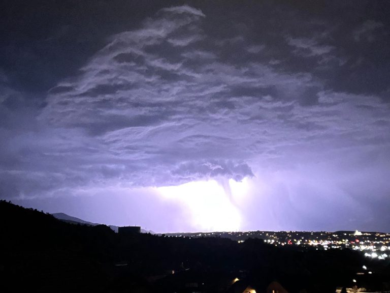 National Weather Service said light from lightning made a shaft of rain look like a funnel cloud over Cedar City, Utah, Thursday.