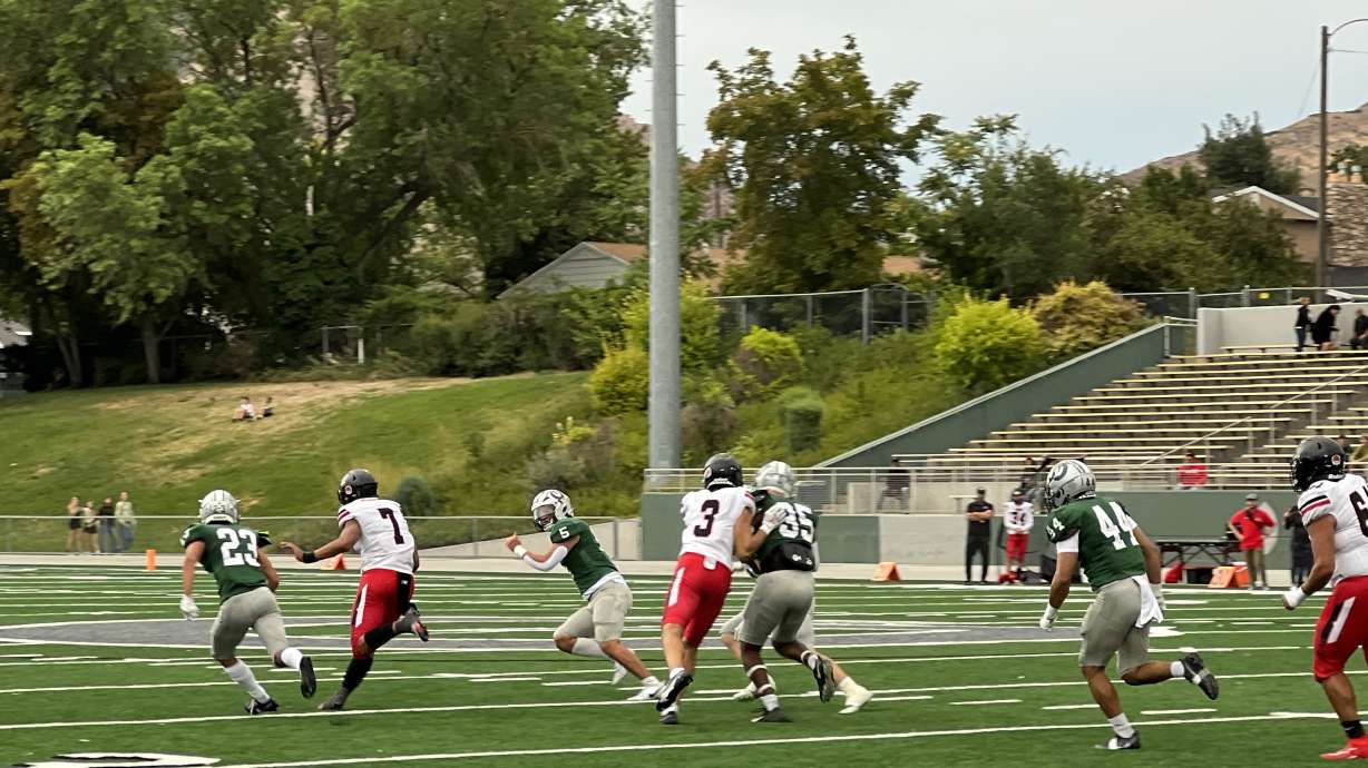 Isaiah SueSue runs the ball for West against Olympus.