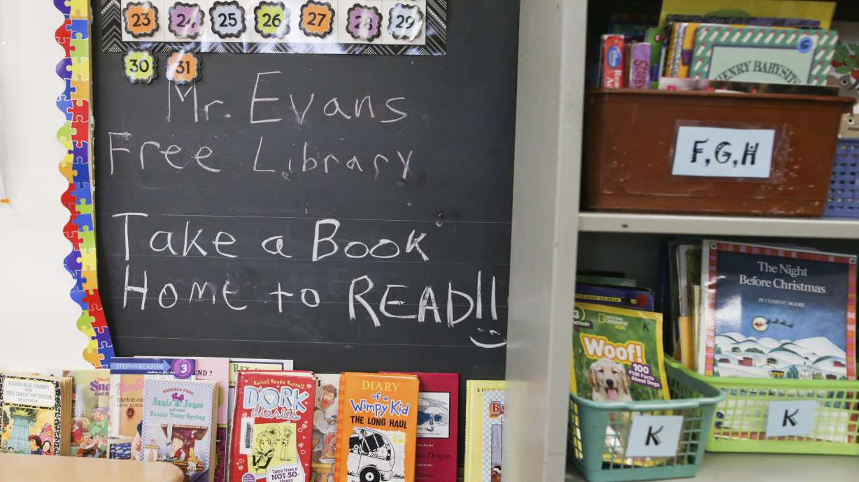 Books are displayed on a free library shelf inside the classroom of Richard Evans, a teacher at Hyde Park Elementary School, on Oct. 20, 2022, in Niagara Falls, N.Y. Stuck with distance learning as they began grade school, the kids who are now finishing elementary school were the ones most disrupted by COVID, with alarming delays in their reading ability.