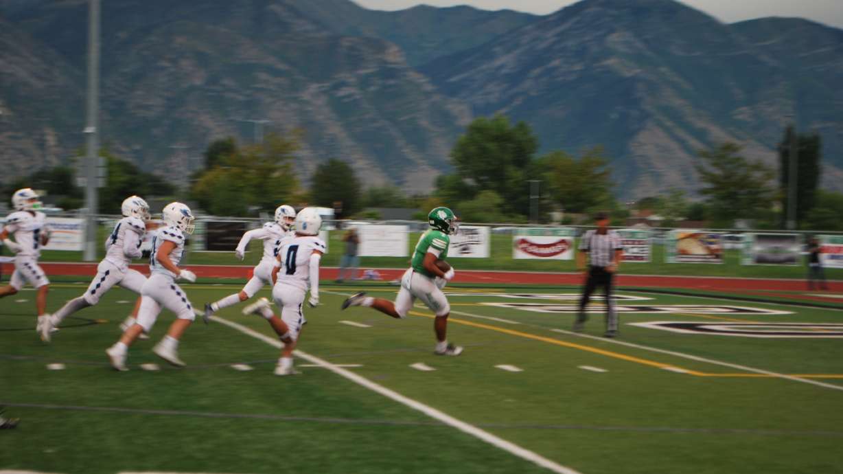 Provo High takes down Salem Hills in a 35-0 sweep. Pictured: Bulldog running back Feitagai Lesa scores his second touchdown of the night in Provo on Sep. 1, 2023.