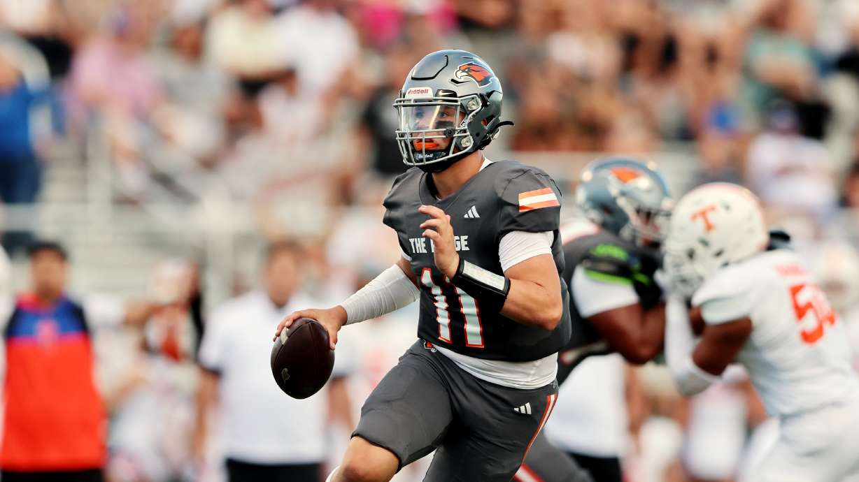 Skyridge’s Jackson Stevens scrambles with the ball as he looks for a receiver against Timpview at Skyridge in Lehi on Friday, Aug. 11, 2023. Skyridge won 26-14.