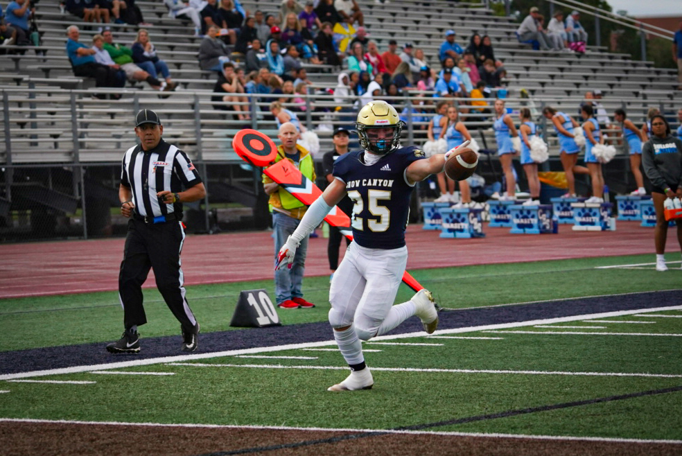 Max Reynolds scores his first touchdown of the game for Snow Canyon.