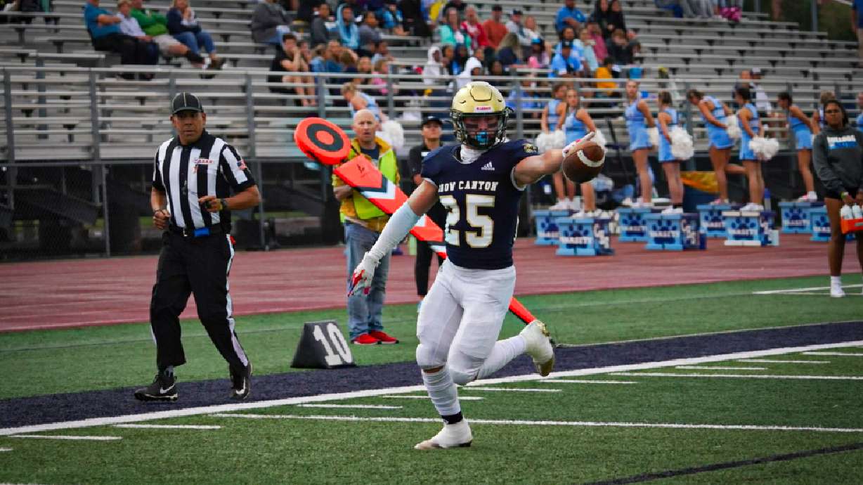 Max Reynolds scores his first touchdown of the game for Snow Canyon.