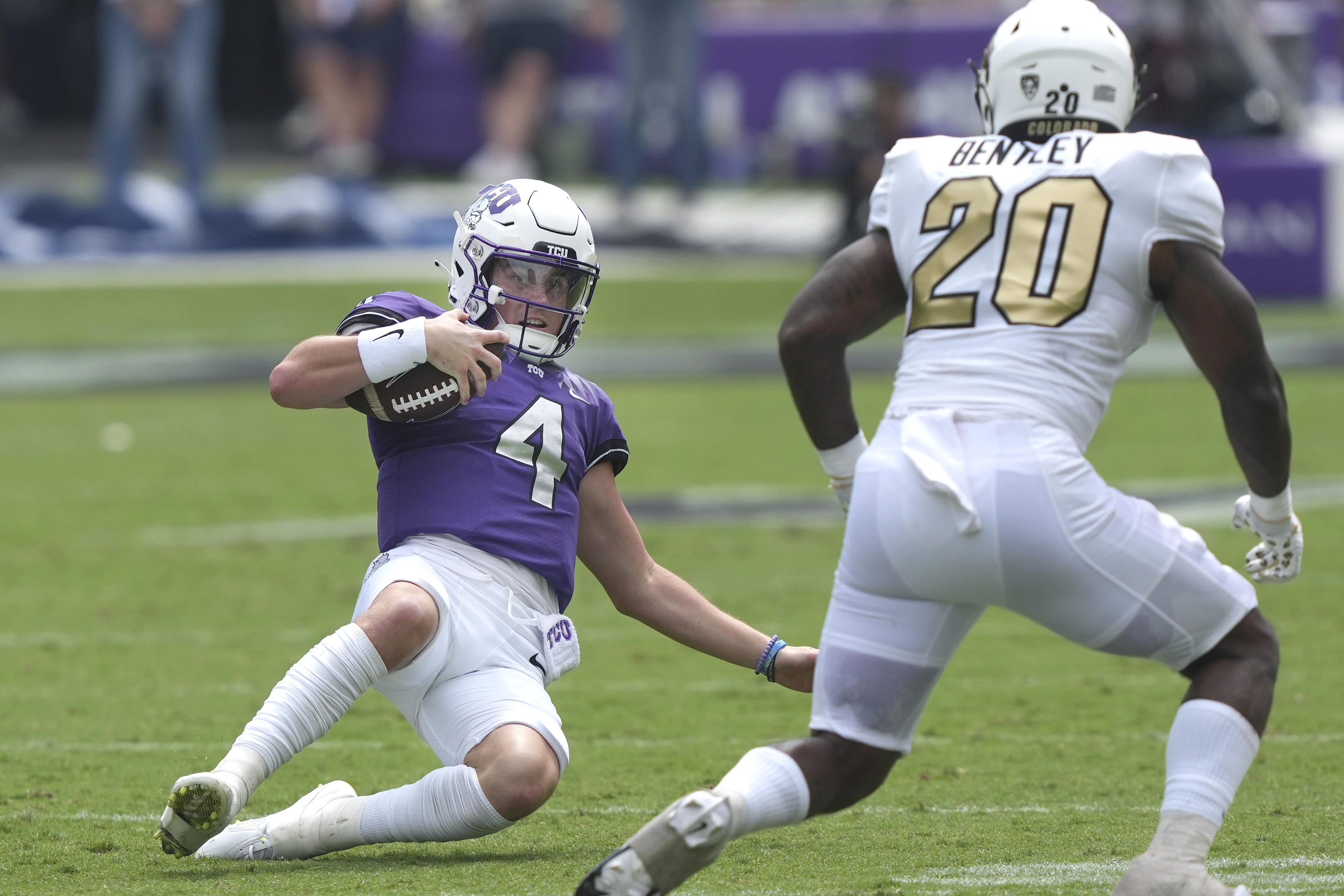 TCU quarterback Chandler Morris (4) slides on a keeper against Colorado linebacker LaVonta Bentley (20) during the first half of an NCAA college football game Saturday, Sept. 2, 2023, in Fort Worth, Texas.