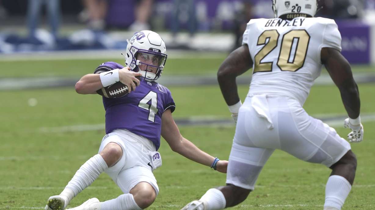 TCU quarterback Chandler Morris (4) slides on a keeper against Colorado linebacker LaVonta Bentley (20) during the first half of an NCAA college football game Saturday, Sept. 2, 2023, in Fort Worth, Texas.
