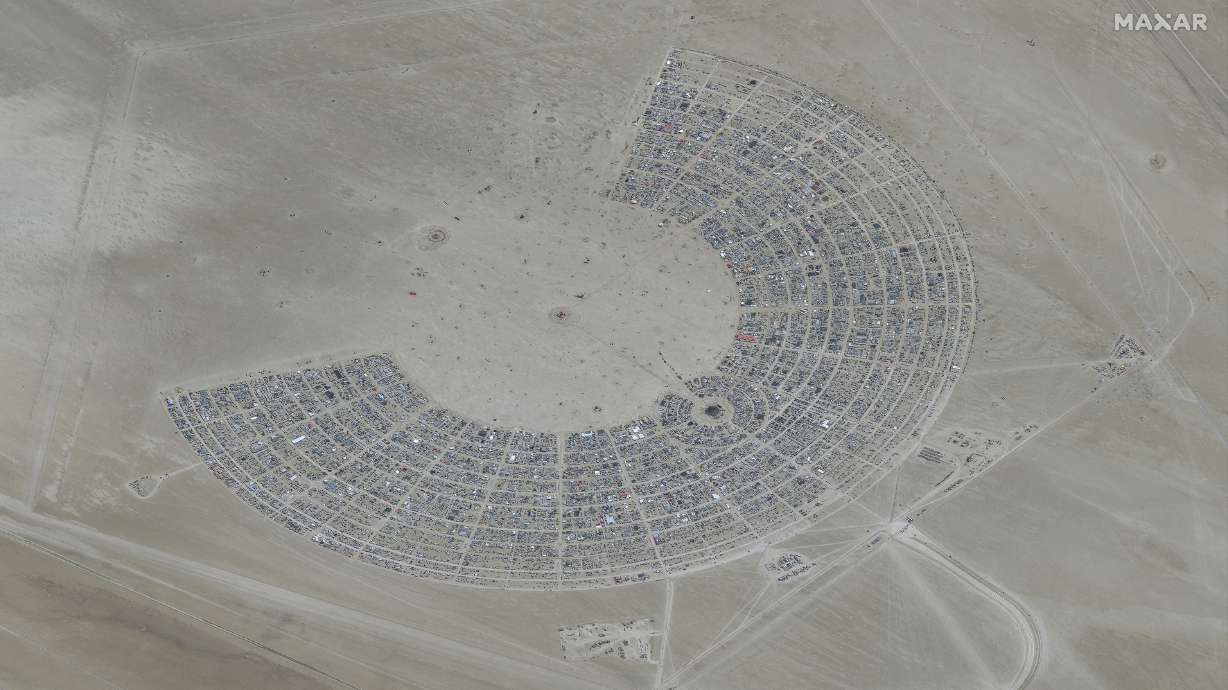 In this satellite photo provided by Maxar Technologies, an overview of Burning Man festival in Black Rock, Nev., on Monday. The entrance to the Burning Man counterculture festival in the Nevada desert has been closed due to flooding from storms.