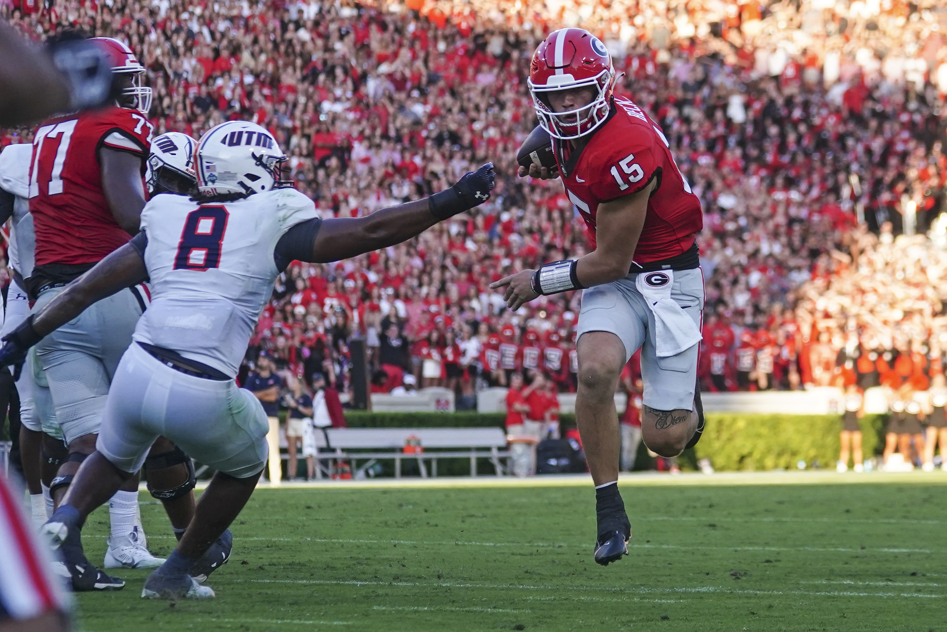 Georgia quarterback Carson Beck (15) runs past Tennessee-Martin linebacker Giovanni Davis (8) to score a touchdown during the first half of an NCAA college football game Saturday, Sept. 2, 2023, in Athens, Ga. 