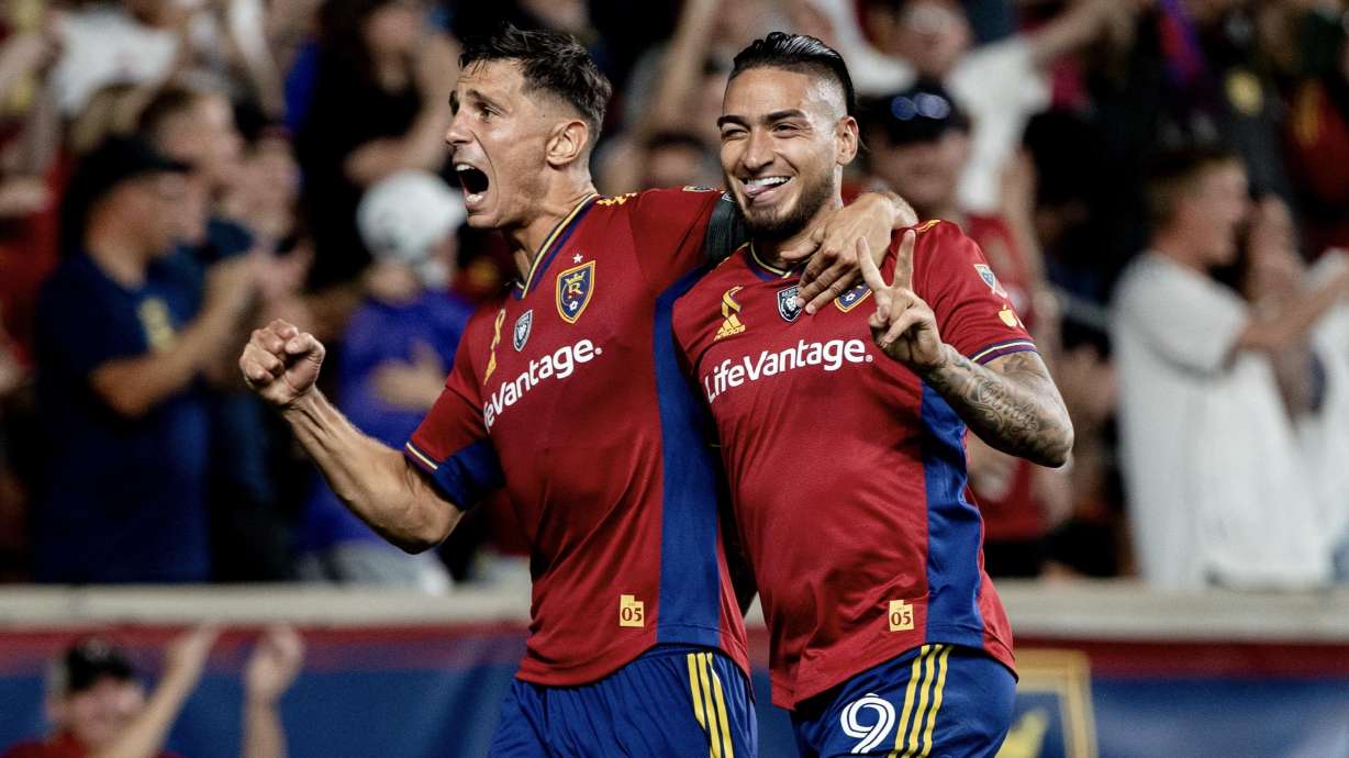 Chicho Arango, right, celebrates his goal with Damir Kreilach, left, at America First Field.