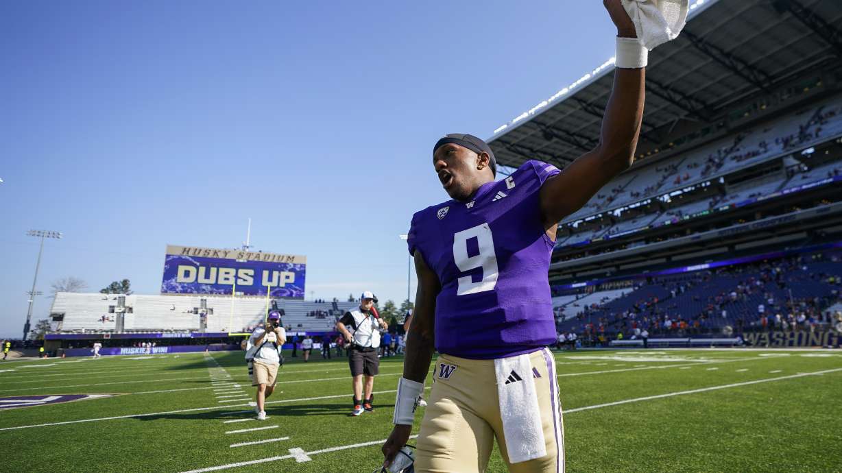 Washington quarterback Michael Penix Jr. celebrates the team's win over Boise State in an NCAA college football game Saturday, Sept. 2, 2023, in Seattle.