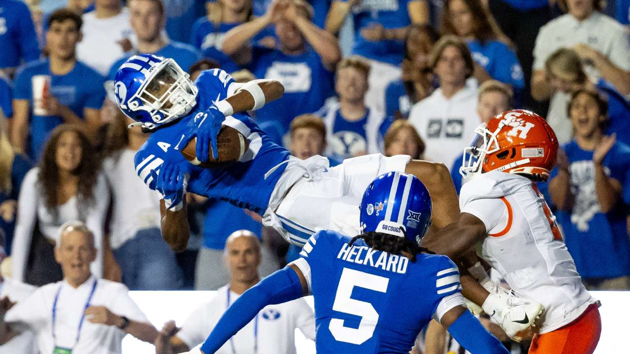 BYU Cougars cornerback Jakob Robinson (0) intercepts a pass in the end zone during the game against the Sam Houston Bearkats at LaVell Edwards Stadium in Provo on Saturday, Sept. 2, 2023.