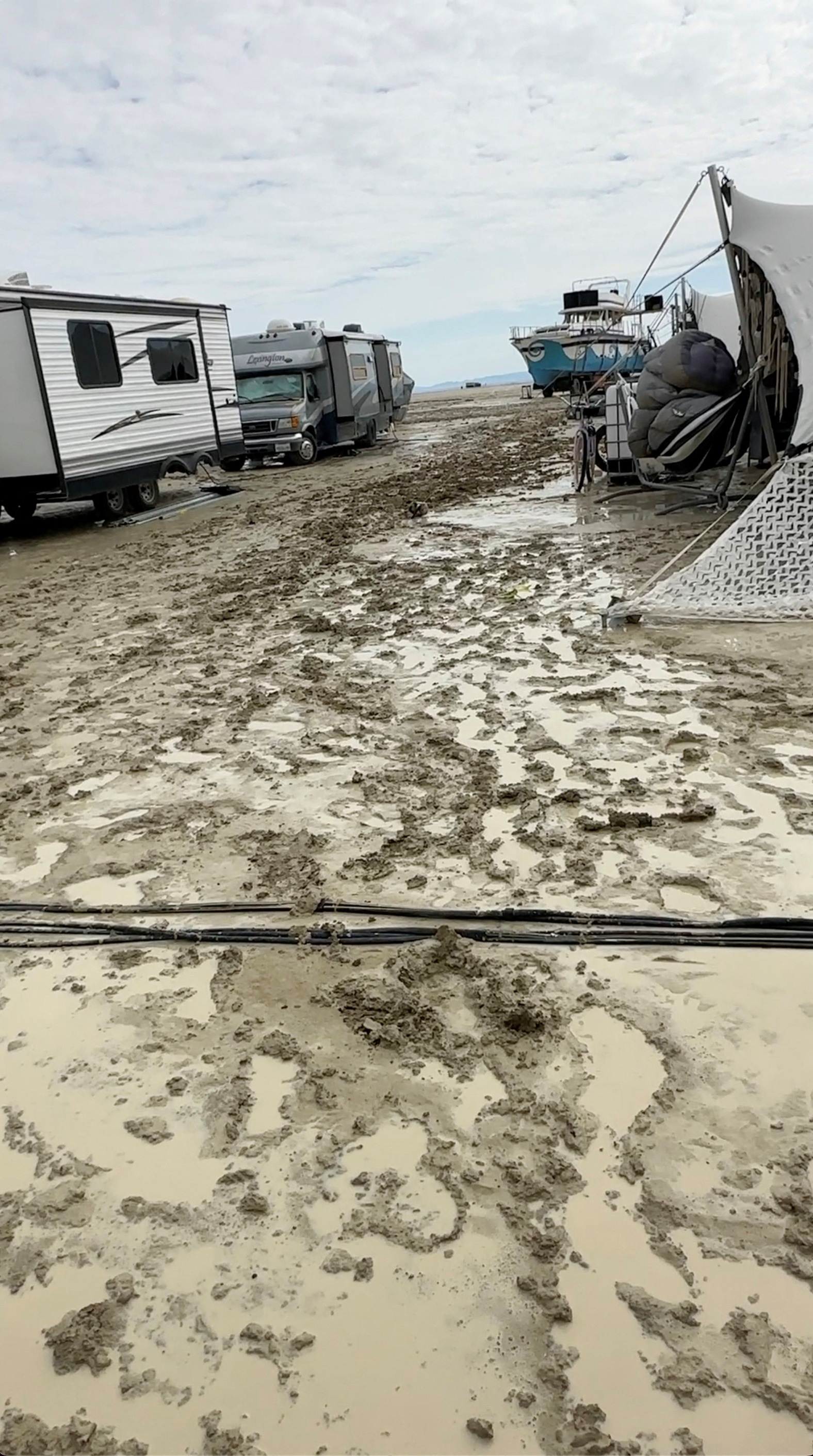 Mud covers the ground at the site of the Burning Man festival in Black Rock, Nev., Friday.