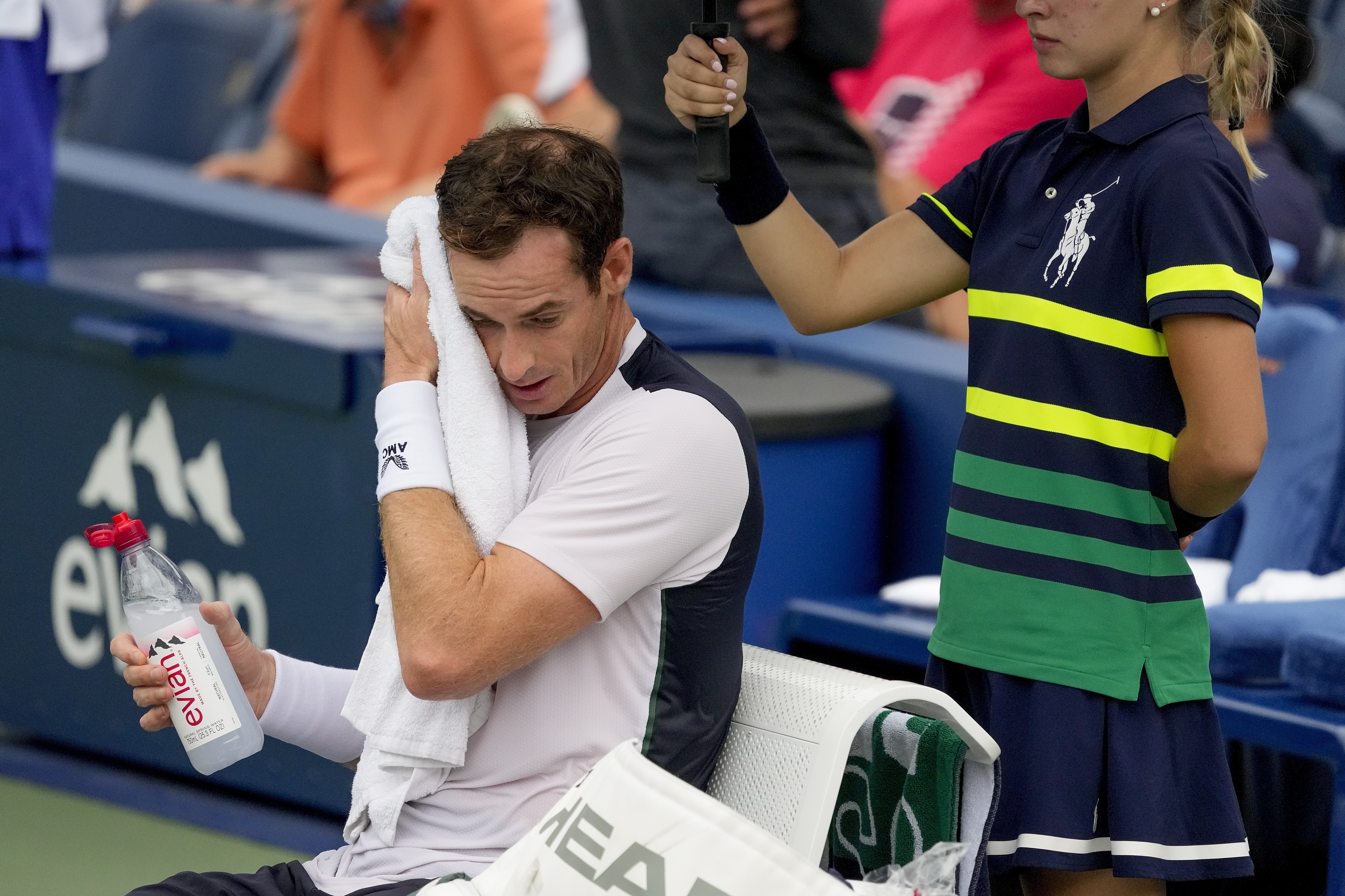 FILE - Andy Murray, of Britain, wipes sweat from his brow during a break in play against Corentin, Moutet, of France, during the first round of the U.S. Open tennis championships, Tuesday, Aug. 29, 2023, in New York. An Associated Press analysis shows the average high temperatures during the U.S. Open and the three other Grand Slam tennis tournaments steadily have grown hotter and more dangerous in recent decades. 