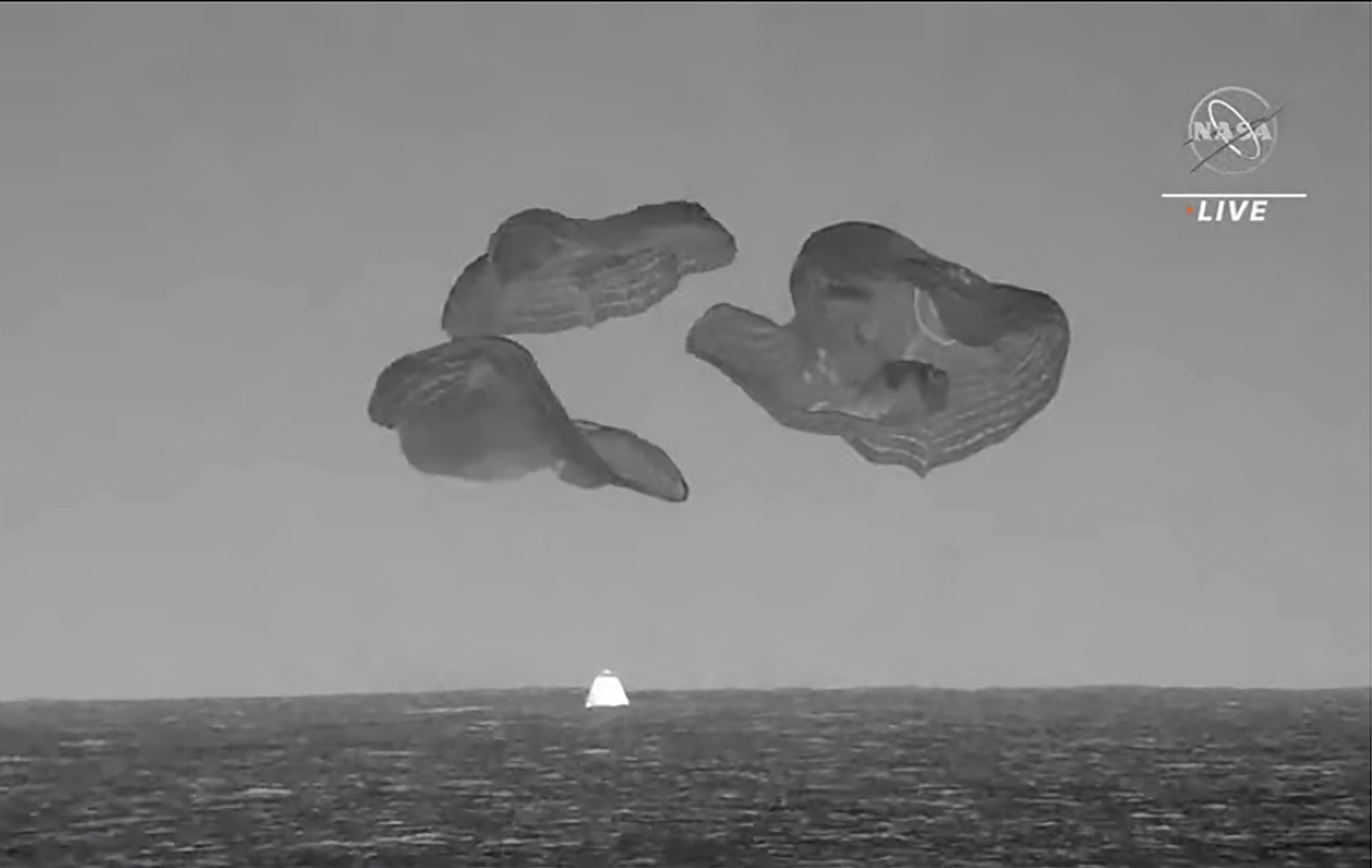 A SpaceX capsule splashes down in the Atlantic Ocean off the Florida coast, Monday as it returns to Earth with four astronauts after a six-month stay at the International Space Station.