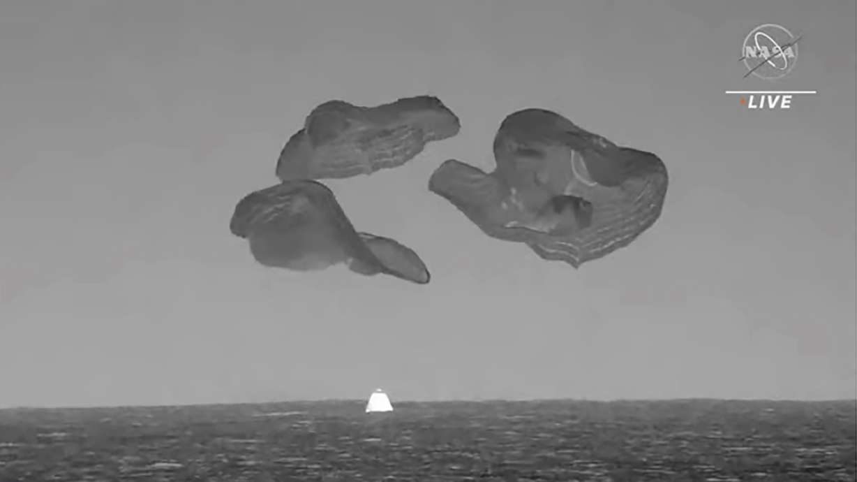 A SpaceX capsule splashes down in the Atlantic Ocean off the Florida coast, Monday as it returns to Earth with four astronauts after a six-month stay at the International Space Station.