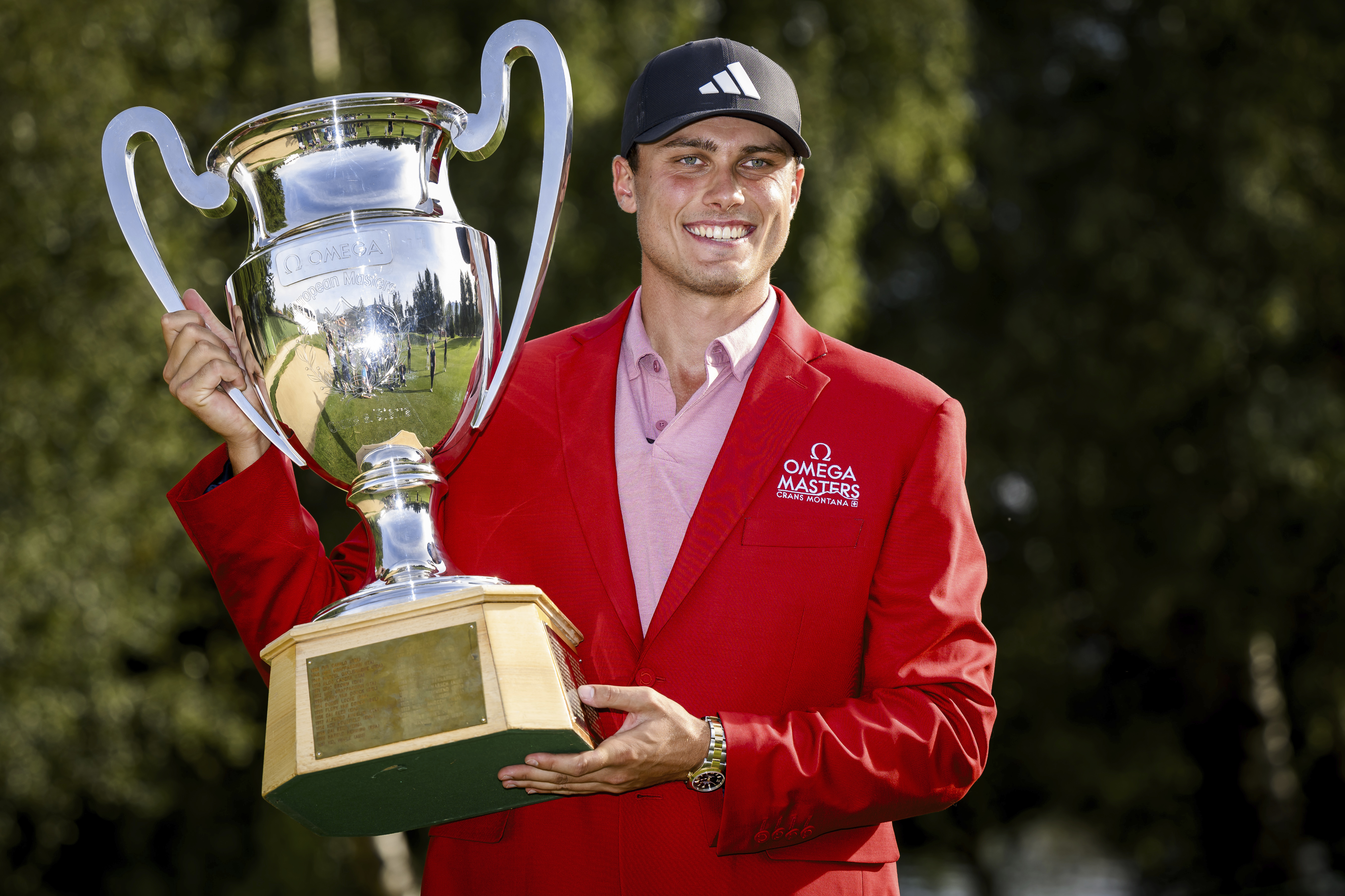 Winner Ludvig Aberg of Sweden poses with the trophy of the European Masters Golf Tournament DP World Tour, in Crans-Montana, Switzerland, Sunday, Sept. 3, 2023.