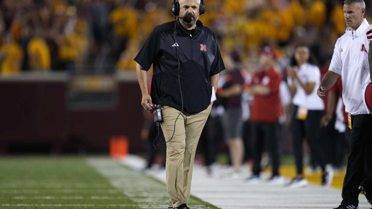 Nebraska coach Matt Rhule walks on the field during the first half of the team's NCAA college football game against Minnesota, Thursday, Aug. 31, 2023, in Minneapolis.