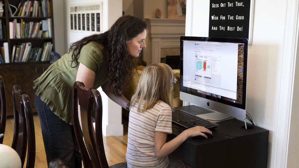 Karyn Tripp and her daughter, Millie, 9, work on Millie’s math with the CTCMath curriculum at their home in Cedar Hills on Aug. 30.