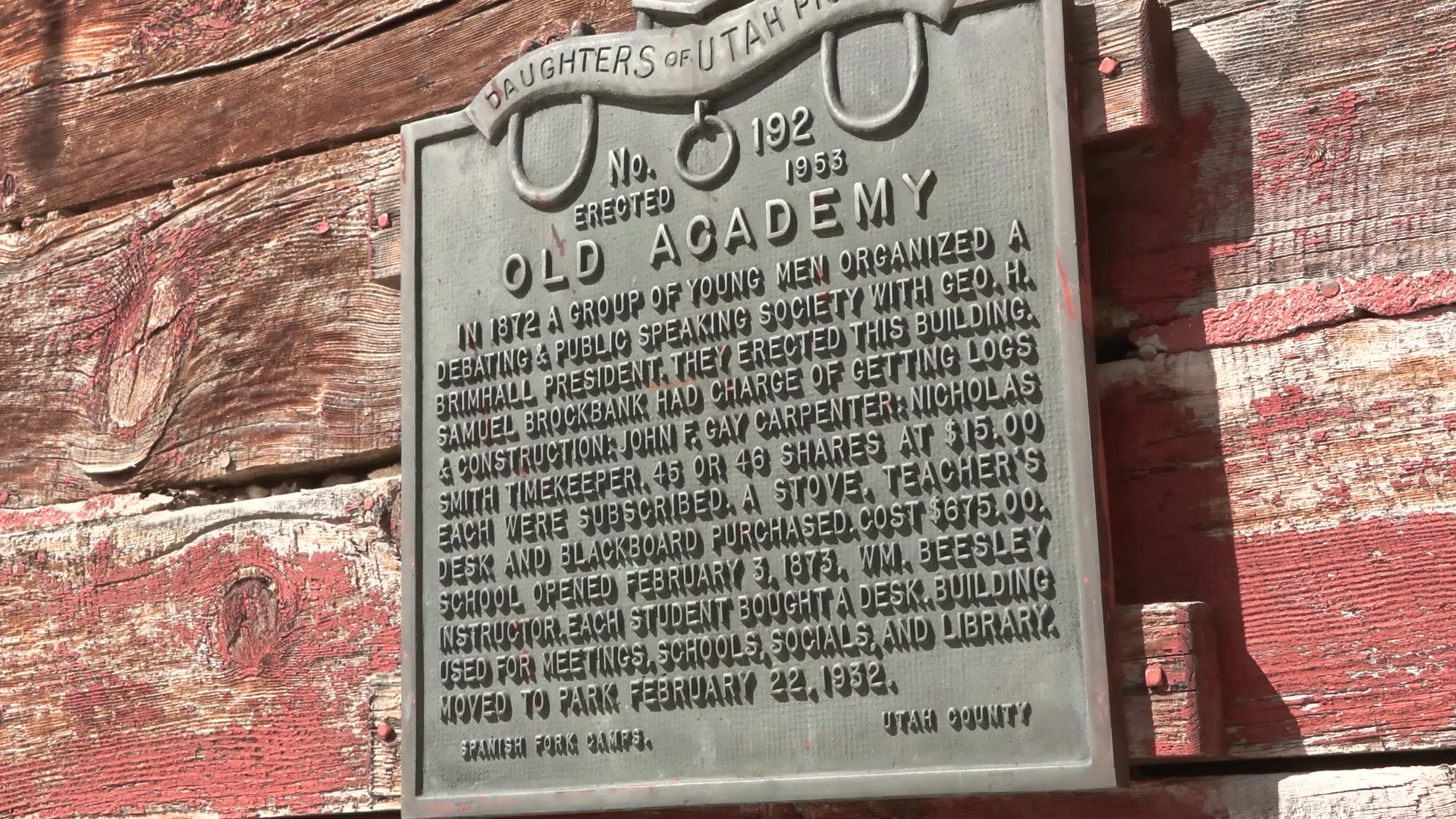 A plaque is shown outside the Spanish Fork historic schoolhouse. The Burton family purchased a home with the schoolhouse in the backyard and would like to open the schoolhouse to the community but need help restoring it.