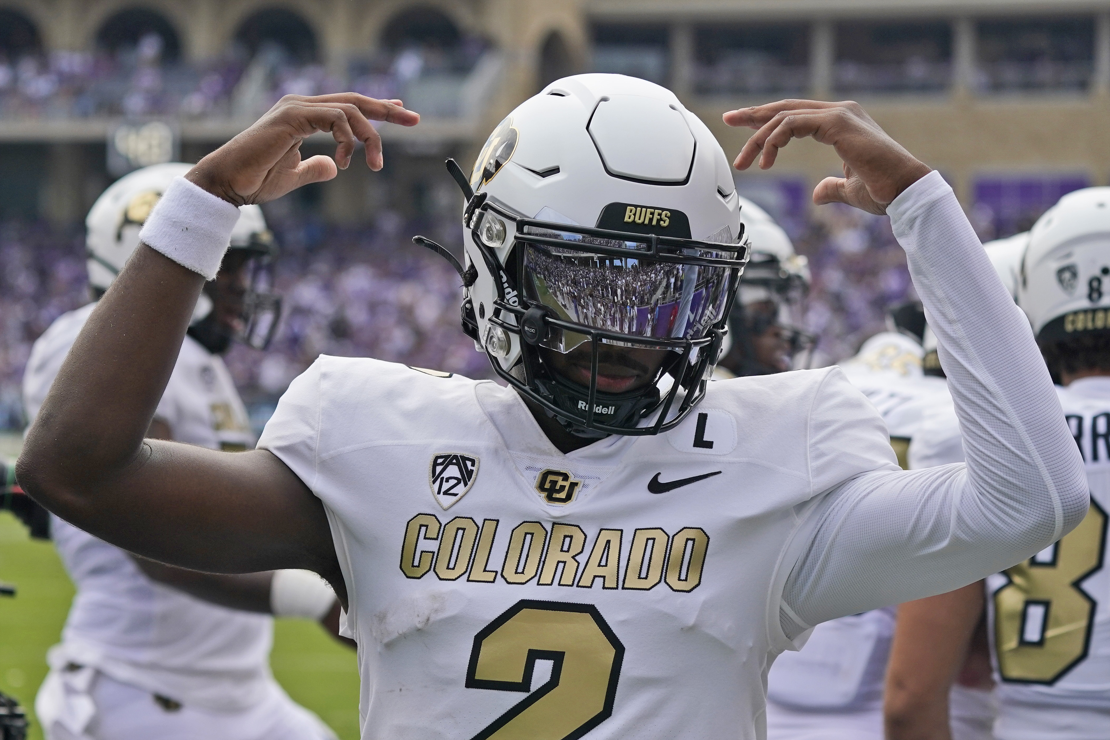 Colorado quarterback Shedeur Sanders (2) celebrates a touchdown during the first half of an NCAA college football game against TCU Saturday, Sept. 2, 2023, in Fort Worth, Texas. 