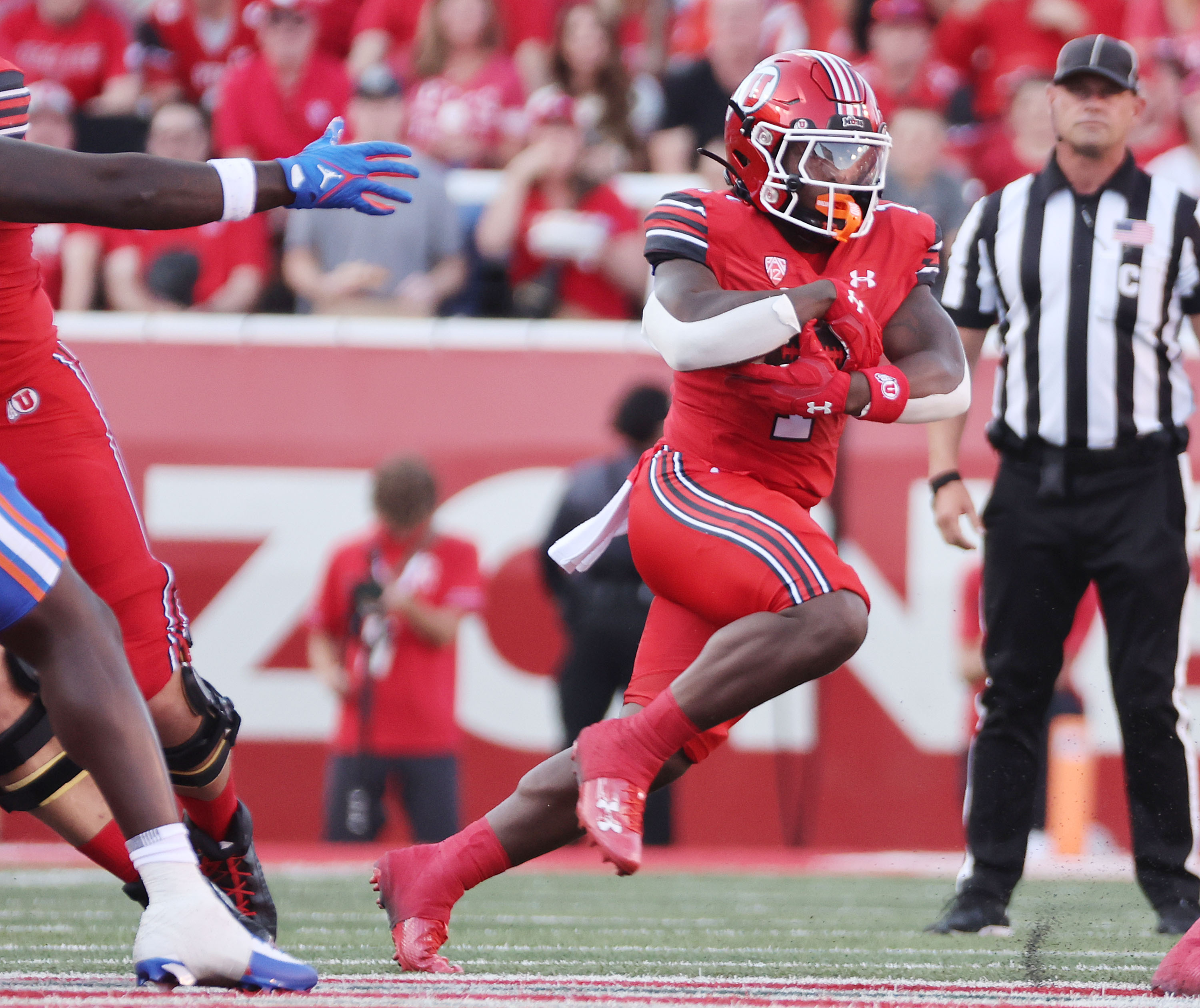 Utah Utes running back Jaylon Glover (1) runs against the Florida Gators in Salt Lake City on Thursday, Aug. 31, 2023 during the season opener. Utah won 24-11.